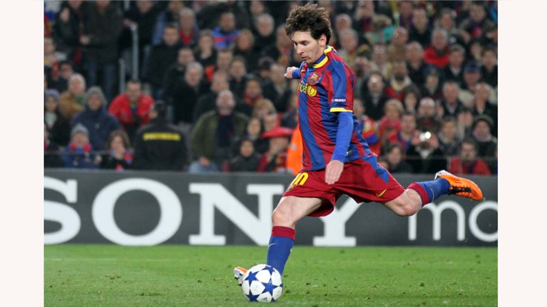 FC Barcelona's Lionel Messi, of Argentina, prepares to kick the penalty during a Champions League, round of 16, second leg soccer match against Arsenal at the Nou Camp, in Barcelona, Spain, Tuesday, March 8, 2011. (AP Photo/Felice Calabro')
