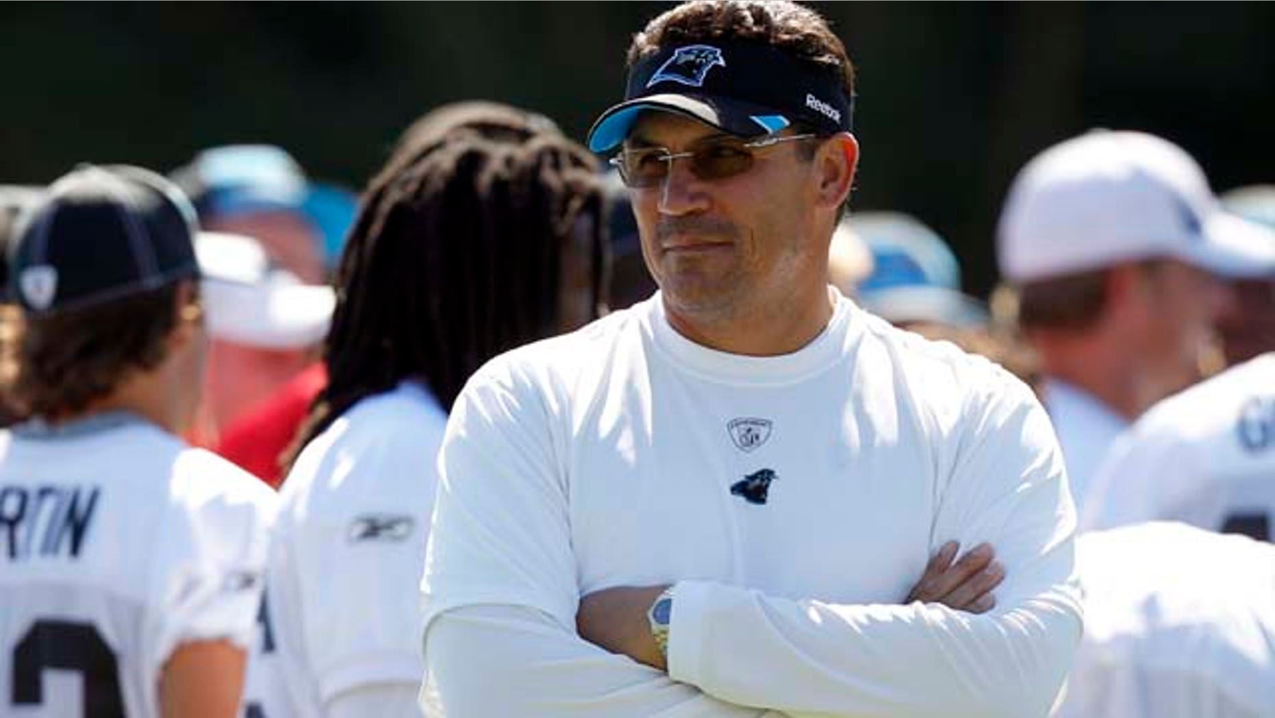 Carolina Panthers head coach Ron Rivera looks over practice at NFL football training camp in Spartanburg, S.C., Wednesday, Aug. 10, 2011. (AP Photo/Chuck Burton)