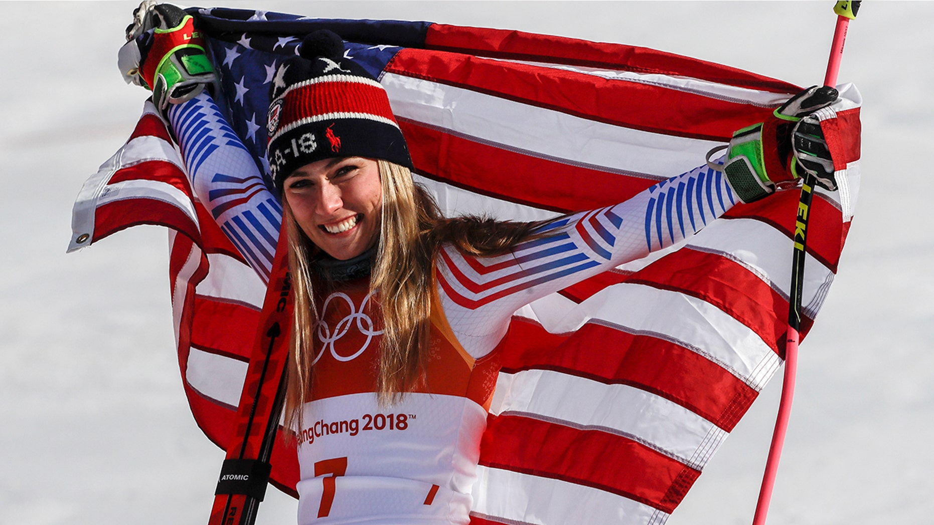 Mikaela Shiffrin celebrates her gold medal after placing first in the women's giant slalom at the 2018 Winter Olympics.