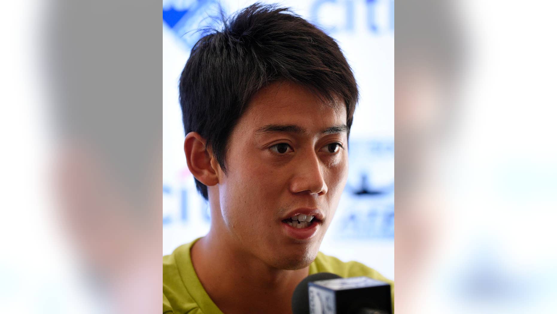 Kei Nishikori, of Japan, speaks at a press conference at the Citi Open tennis tournament, Monday, Aug. 3, 2015, in Washington. (AP Photo/Nick Wass)
