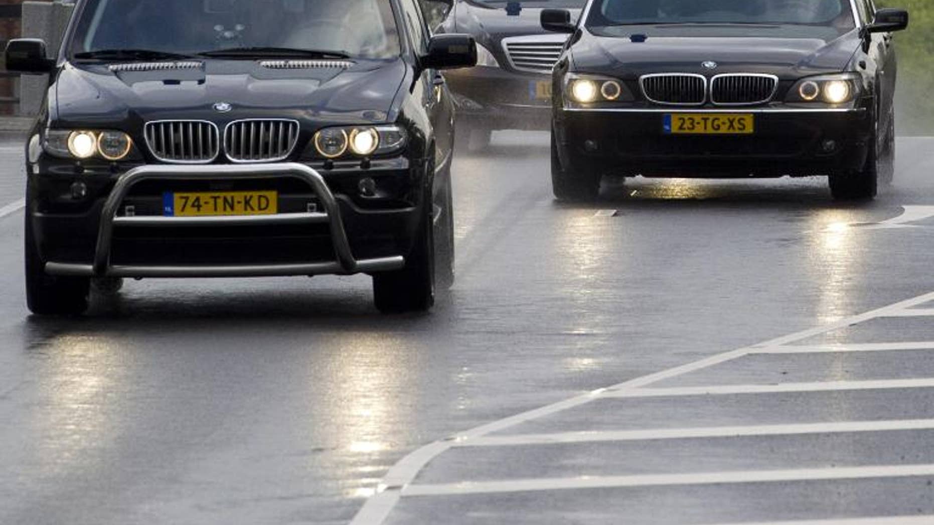 Police cars are seen in Amsterdam on June 23, 2011