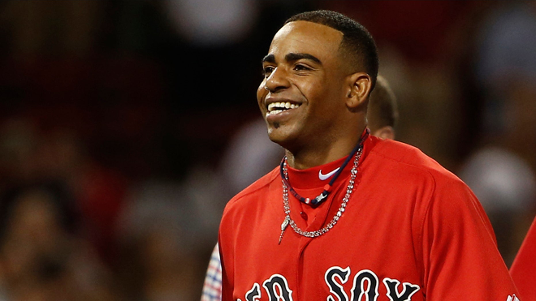 Boston Red Sox's Yoenis Cespedes smiles after the Red Sox defeated the New York Yankees 4-3 in a baseball game at Fenway Park in Boston on Friday, Aug. 1, 2014. (AP Photo/Winslow Townson)