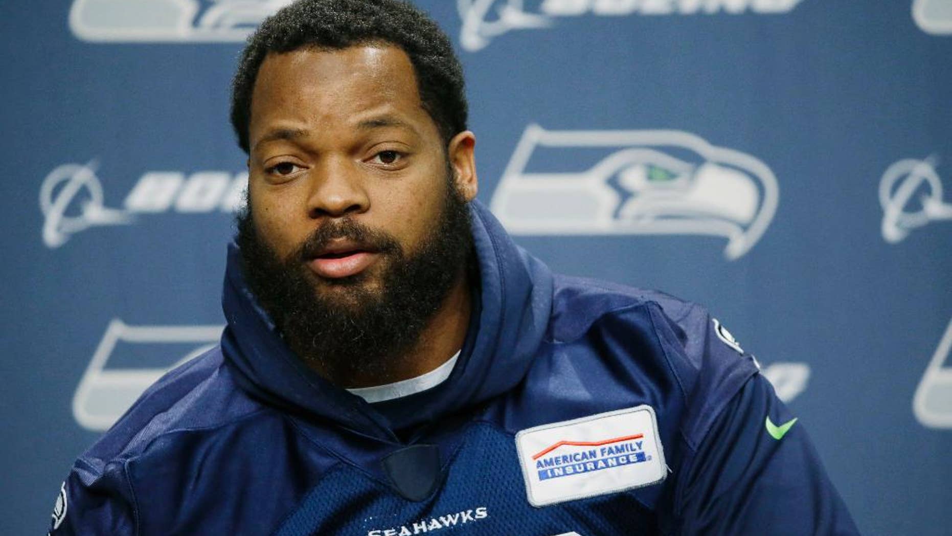 FILE -- In this Jan. 10, 2017 file photo, Seattle Seahawks defensive end Michael Bennett talks to reporters, in Renton, Wash. In a letter posted on Twitter Saturday, Feb. 11, 2017, the American professional football player pulled out of a planned trip to Israel, accusing its government of trying to use him for PR purposes. Bennett cited Muhammad Ali's support for the Palestinians, saying he too wanted to be a "voice for the voiceless." (AP Photo/Ted S. Warren, File)