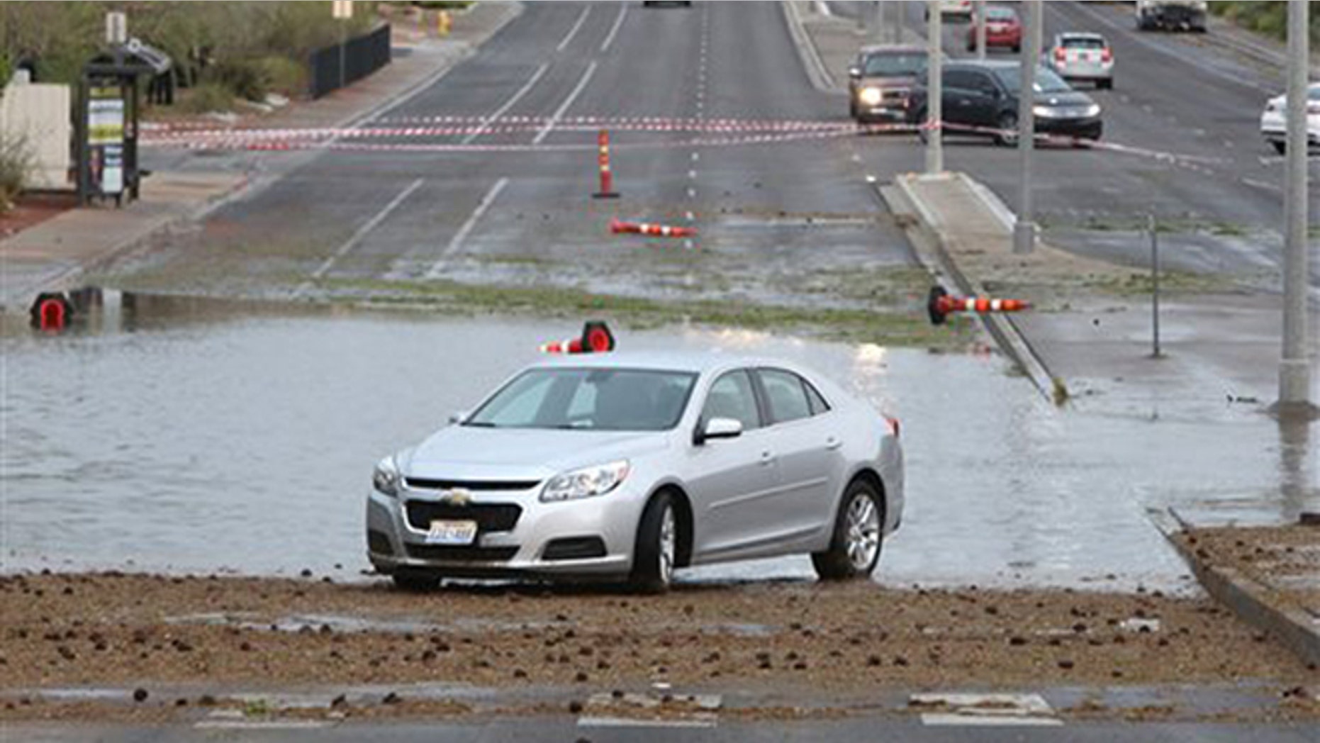 June 30, 2016: A disabled vehicle sits on Pecos Road near Robindale Road and Windmill Parkway due to flooding as late afternoon storms move through Las Vegas Valley in Las Vegas.