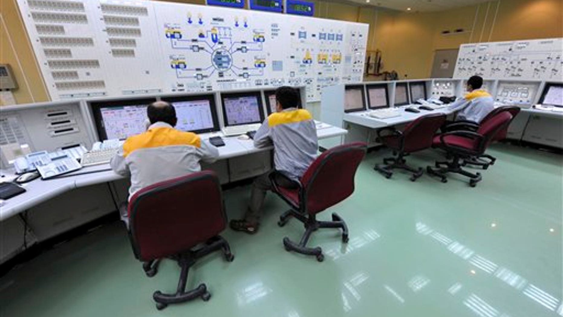Iranian technicians work at the Bushehr nuclear power plant, outside the southern Iranian city of Bushehr.