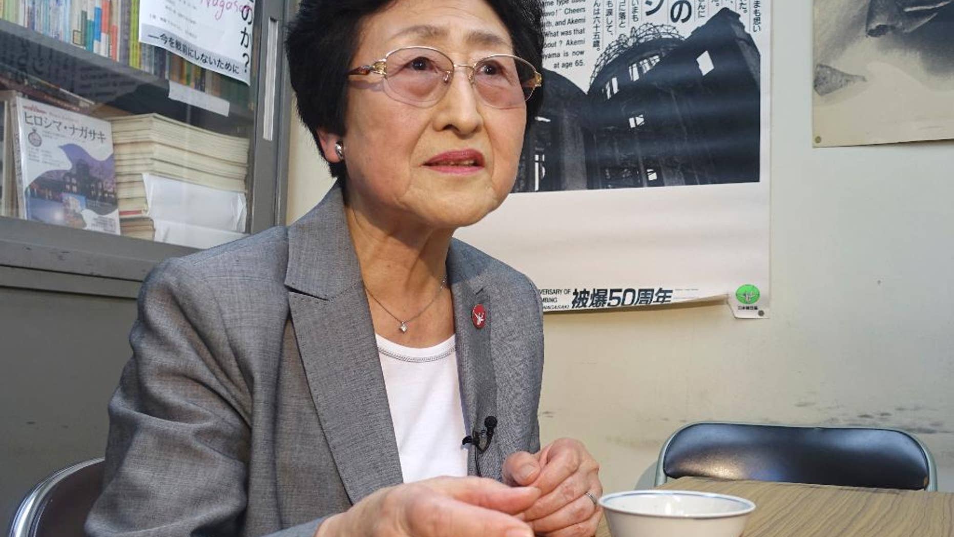 In this Thursday, May 12, 2016 photo, Michiko Kodama, 78, a survivor of the Hiroshima atomic bombing, speaks during an interview at an office of a survivors' organization in Tokyo. A flash in the sky over Hiroshima, Japan, in 1945 caused a lifetime of ordeal for an elementary school student Michiko Kodama. For her World War II will not be over until a nuclear-free world is achieved and President Barack Obama’s visit to Hiroshima on Friday is “just a step in the process.” (AP Photo/Mari Yamaguchi)