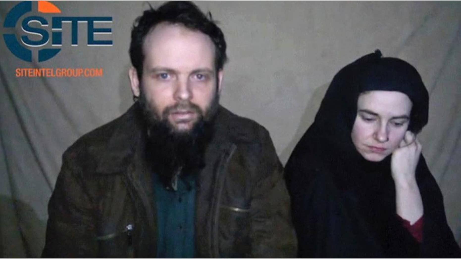 FILE - This undated militant file image from video posted online in August 2016, which has not been independently verified by The Associated Press, provided by SITE Intel Group, shows Canadian Joshua Boyle and American Caitlan Coleman, who were kidnapped in Afghanistan in 2012. Officials in Canada are calling for the unconditional release of Boyle and his wife following the release of another video on Monday, Dec. 19, 2016, that appears to show them begging for their governments to intervene with their Afghan captors on their behalf. (SITE Intel Group via AP, File)