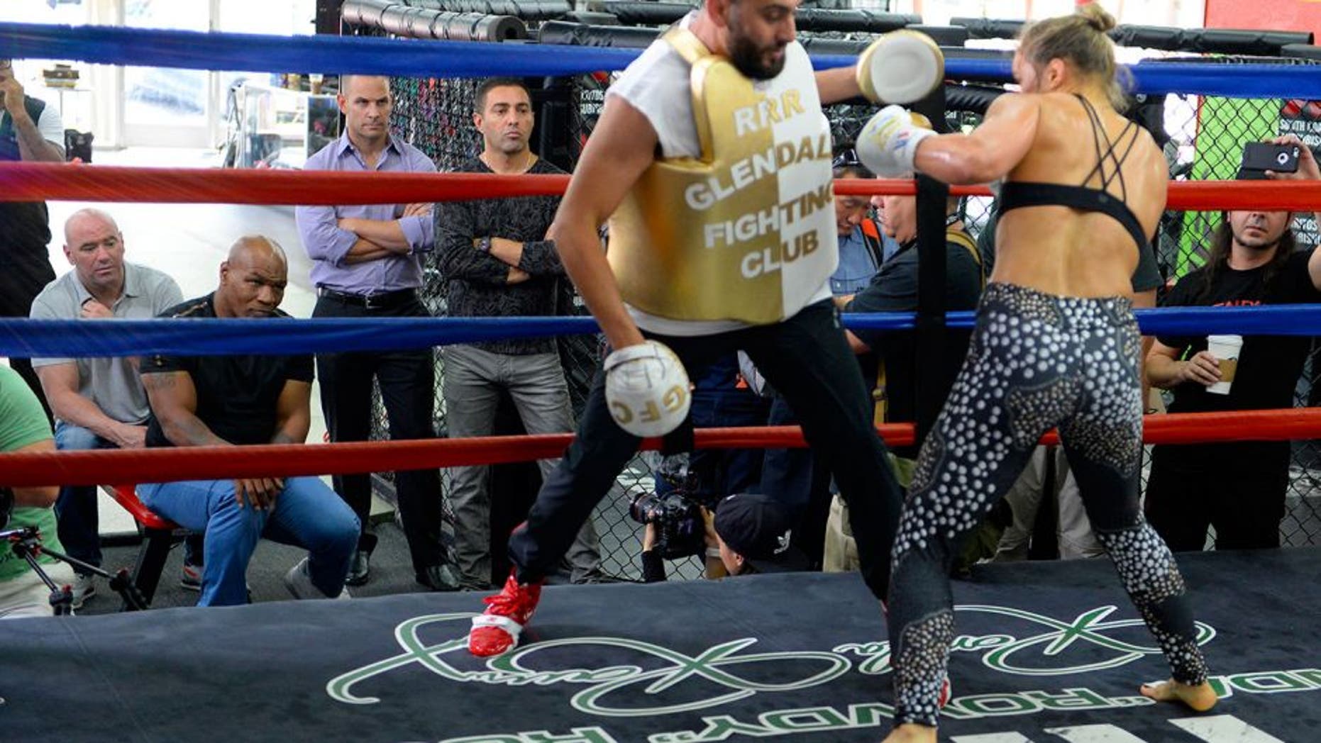 GLENDALE, CA - JULY 15: Former boxer Mike Tyson and UFC president Dana White watch UFC Bantamweight champion Ronda Rousey as she spars with trainer Edmond Tarverdyan during a media training session at the Glendale Fight Club on July 15, 2015 in Glendale, California. (Photo by Robert Laberge/Zuffa LLC/Zuffa LLC via Getty Images)