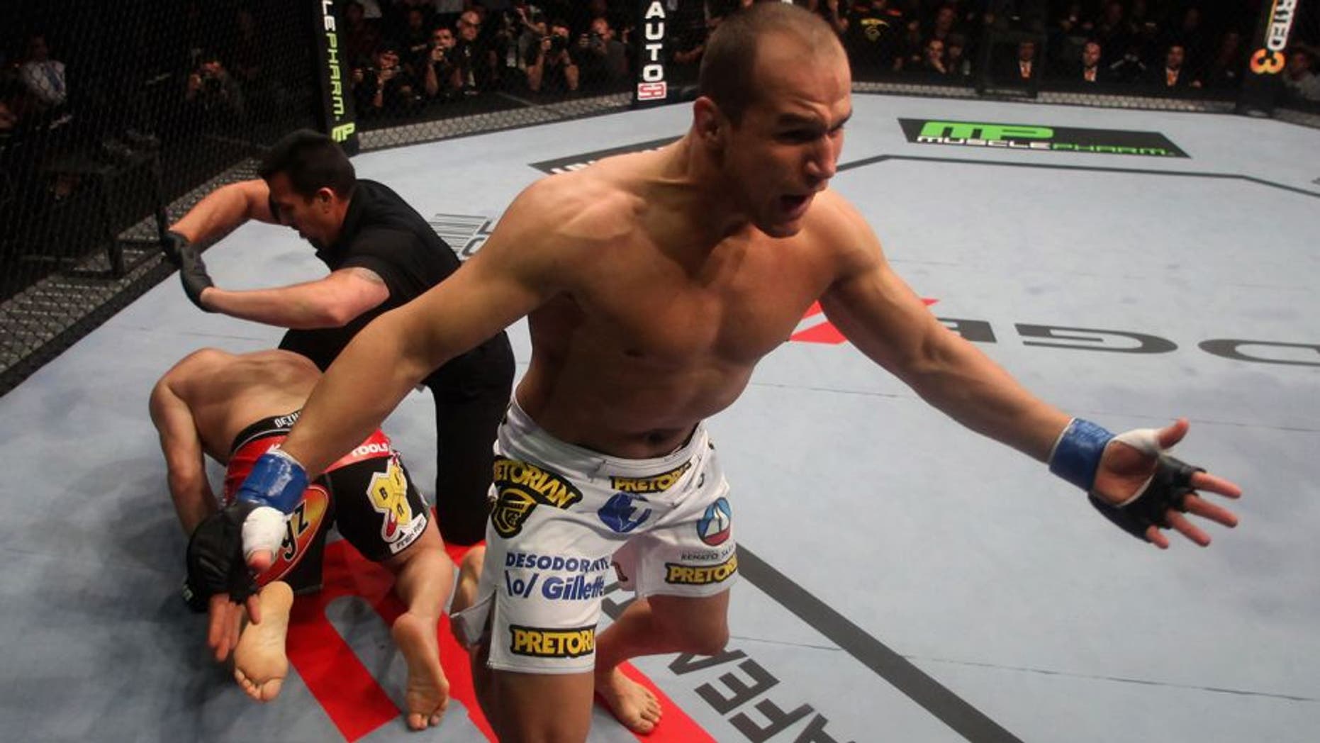 ANAHEIM, CA - NOVEMBER 12: Junior dos Santos celebrates after punching to defeat Cain Velasquez by TKO in the first round of their Heavyweight Championship Title bout during the UFC on FOX event at the Honda Center on November 12, 2011 in Anaheim, California. (Photo by Donald Miralle/Zuffa LLC/Zuffa LLC via Getty Images)