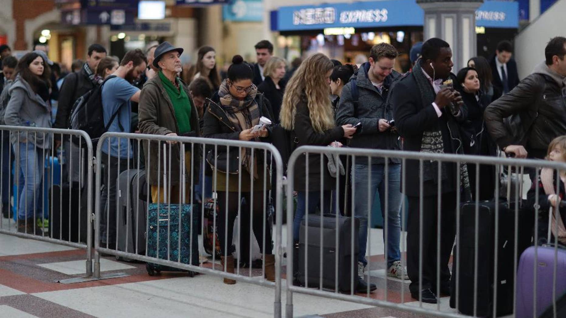 FILE - In this Tuesday, Dec. 13, 2016 file photo, passengers queue up for an express train to Gatwick Airport, running a reduced service as a result of a train strike, in Victoria rail station London. The United Kingdom faces a Christmas of discontent as labor unions threaten to disrupt airports, rail services and mail deliveries.
The Unite union and aviation services company Swissport announced negotiation plans Saturday, Dec. 17 intended to avert a Dec. 23 walkout by 1,500 baggage handlers, check-in staff and other workers at 18 airports. (AP Photo/Matt Dunham, file)