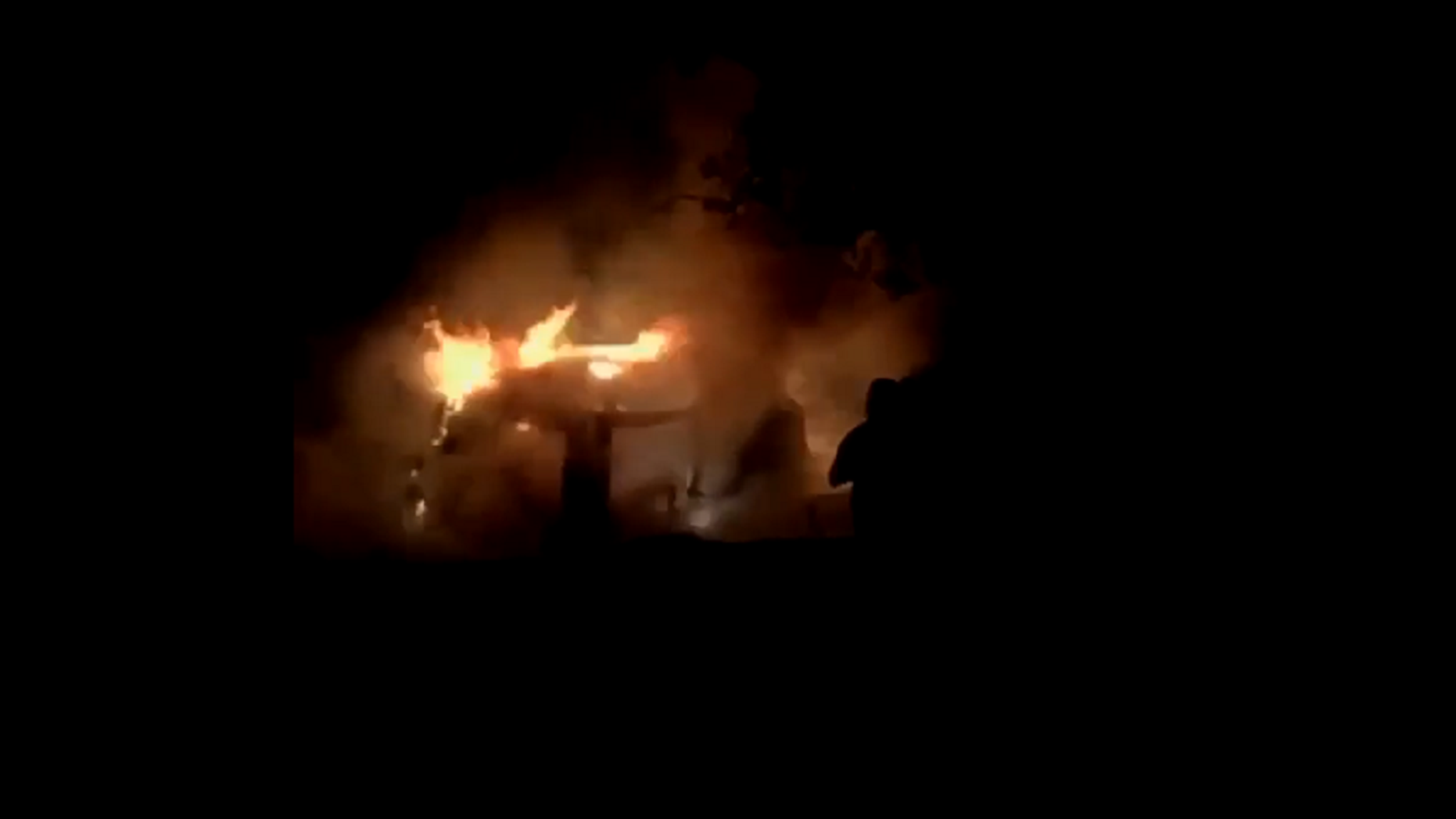 Two teenage boys and a man jumped in to save two people trapped in a burning vehicle on Friday.