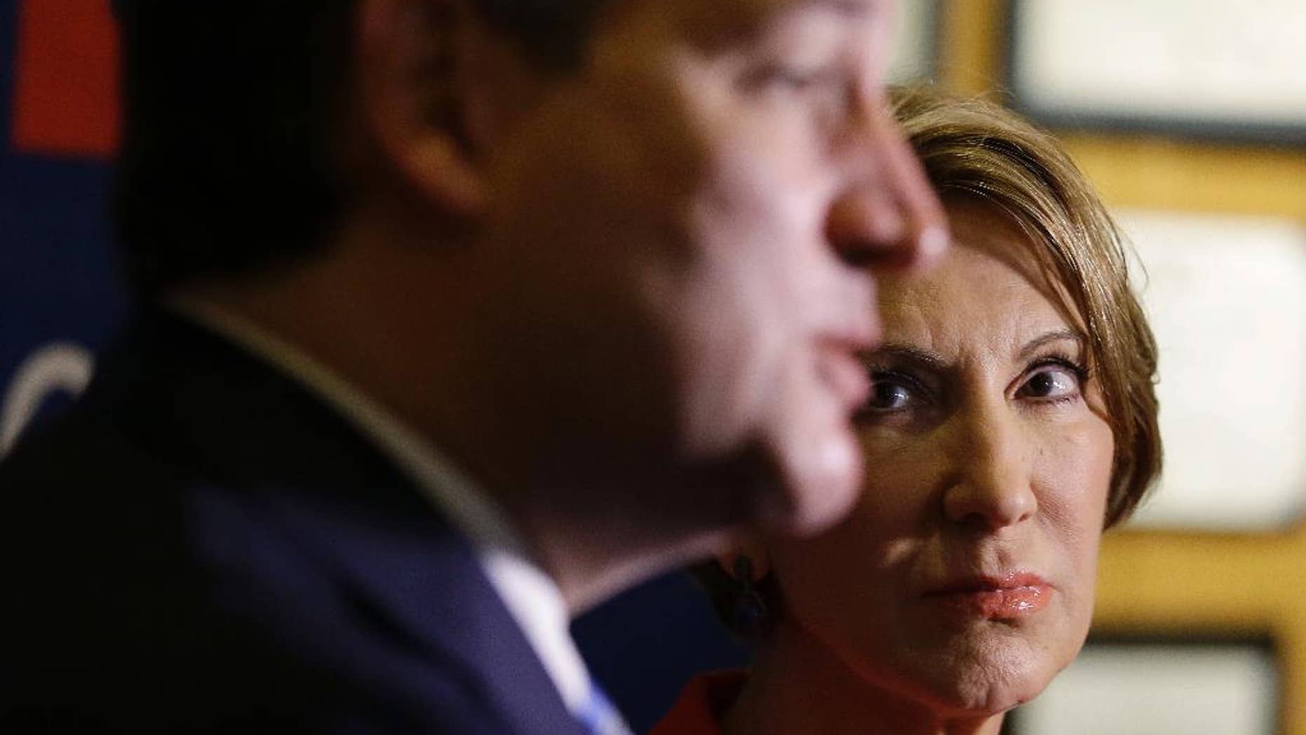 Vice-presidential candidate Carly Fiorina listens as Republican presidential candidate, Sen. Ted Cruz, R-Texas, speaks during a campaign stop at The Indiana War Memorial Friday, April 29, 2016, in Indianapolis. (AP Photo/Darron Cummings)