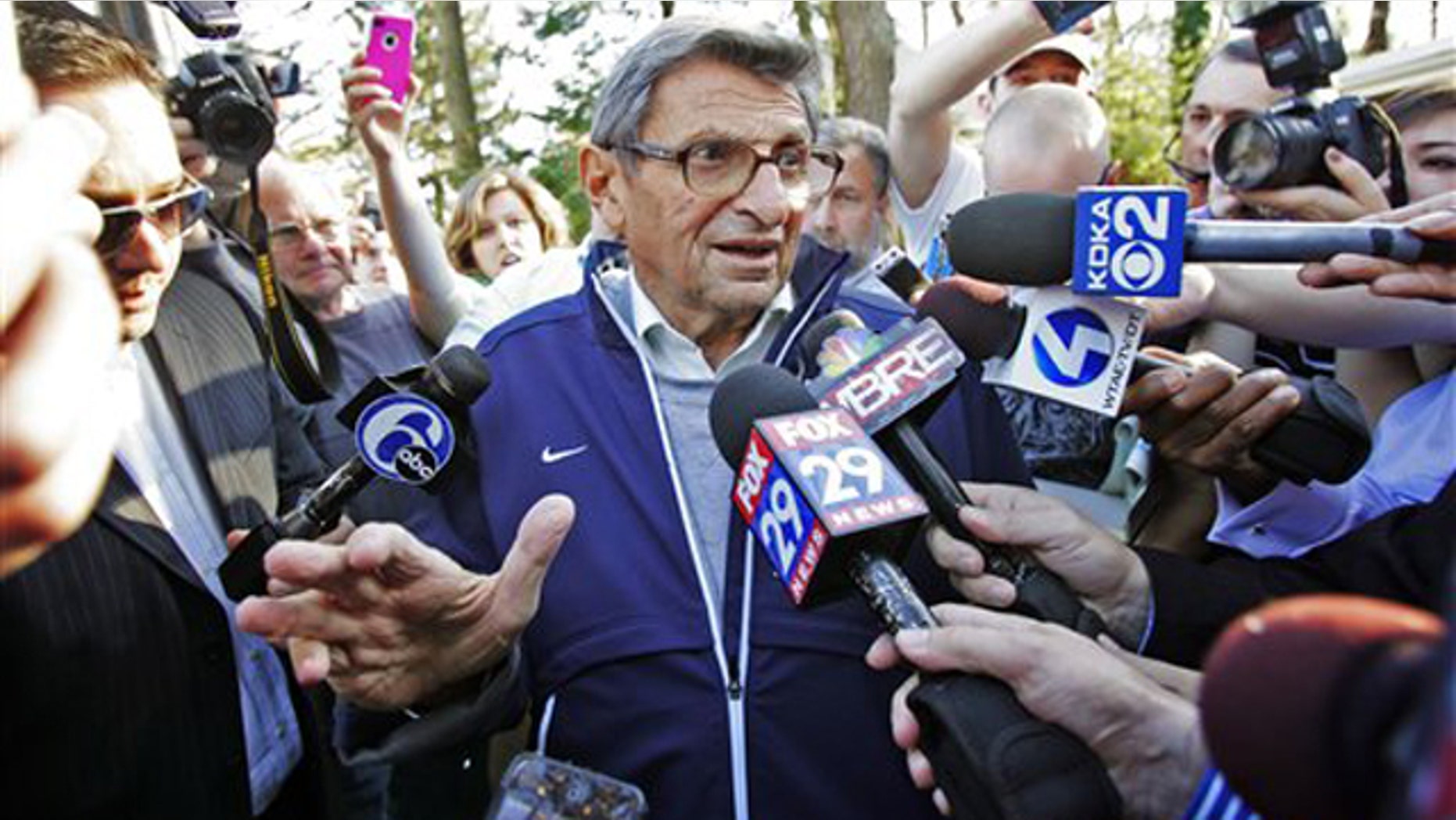 Nov. 8: Penn State football coach Joe Paterno speaks briefly to reporters as he leaves for football practice in State College, Pa. Paterno was later fired by the university board of trustees for not doing more to report allegations of child sex abuse by his former defensive coordinator Jerry Sandusky, who retired in 1999.