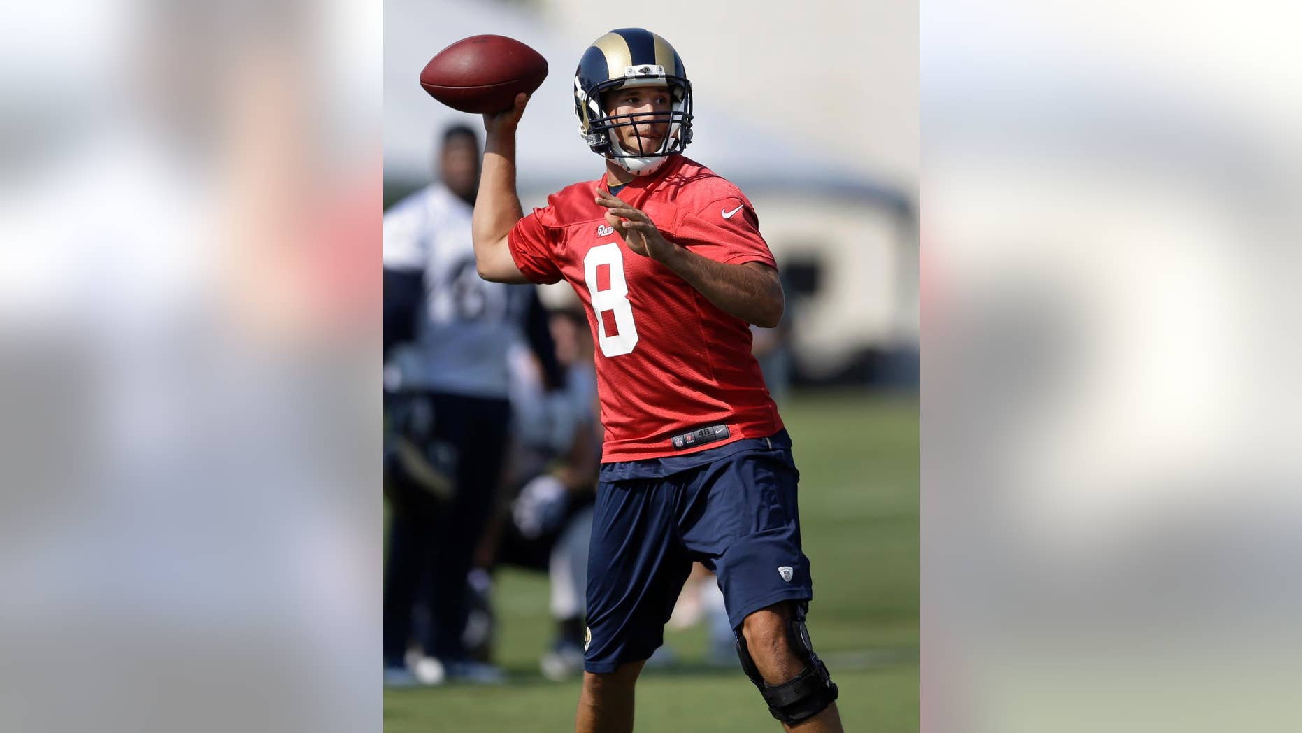 St. Louis Rams quarterback Sam Bradford throws during training camp at the NFL football team's practice facility on Friday, July 25, 2014, in St. Louis. (AP Photo/Jeff Roberson)