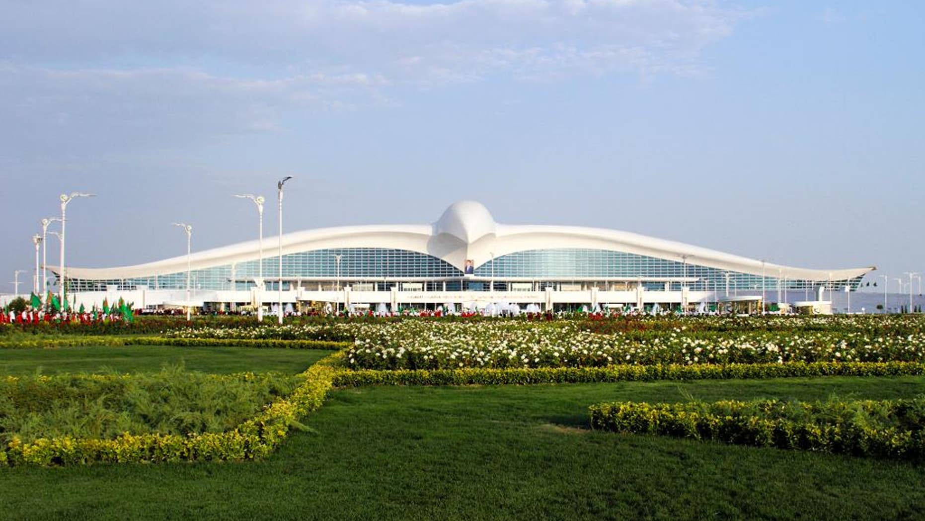 A view of the new international airport terminal outside Ashgabat, Turkmenistan, Saturday, Sept. 17, 2016. The capital of Turkmenistan, a country largely closed to outsiders, has opened a $2.3-billion terminal at its international airport in the shape of a flying falcon. The terminal, whose roof in profile resembles a bird with spread wings, adds to Ashgabat's vast array of gleaming, idiosyncratic buildings. (AP Photo)