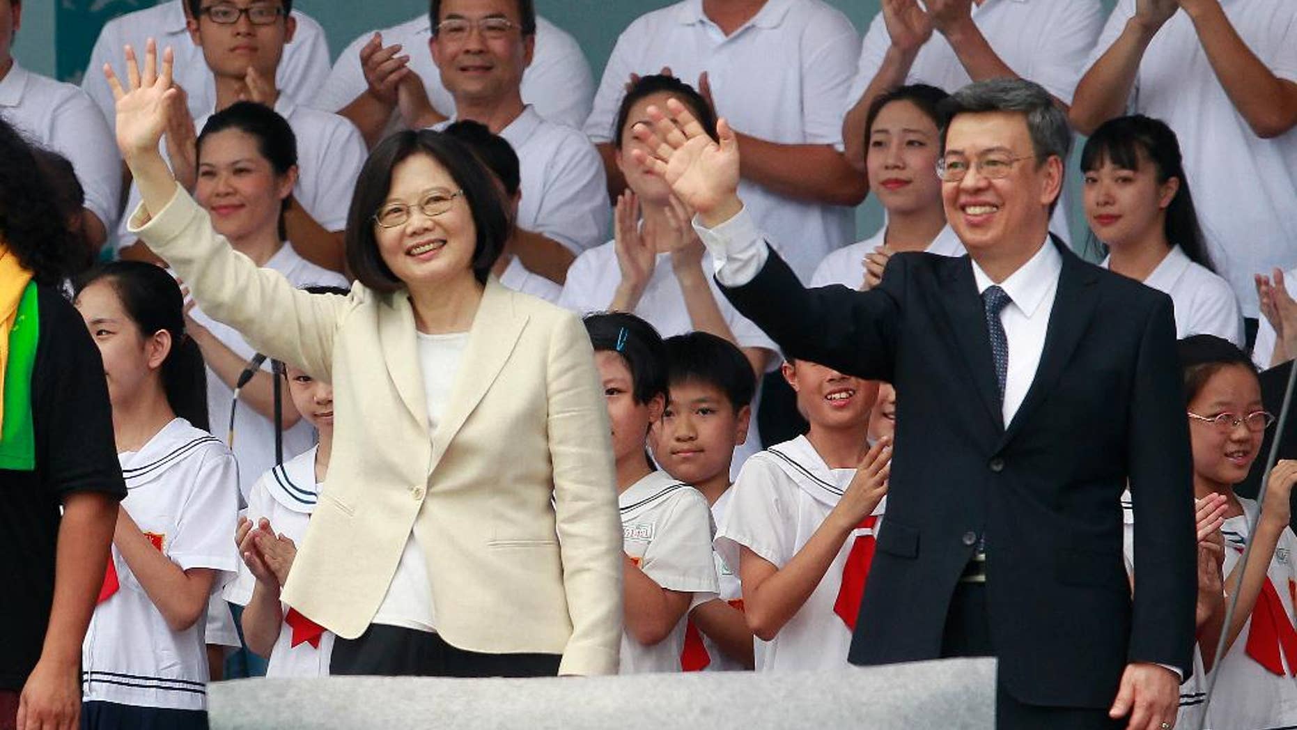 FILE - In this May 20, 2016 file photo, new Taiwan's President Tsai Ing-wen, left, and Vice President Chen Chien-jen wave during their inauguration ceremonies in Taipei, Taiwan. Taiwan's foreign minister says on Thursday, May 26, President Tsai will visit diplomatic allies Panama and Paraguay next month in her first overseas trip since taking office. (AP Photo/Chiang Ying-ying, File)