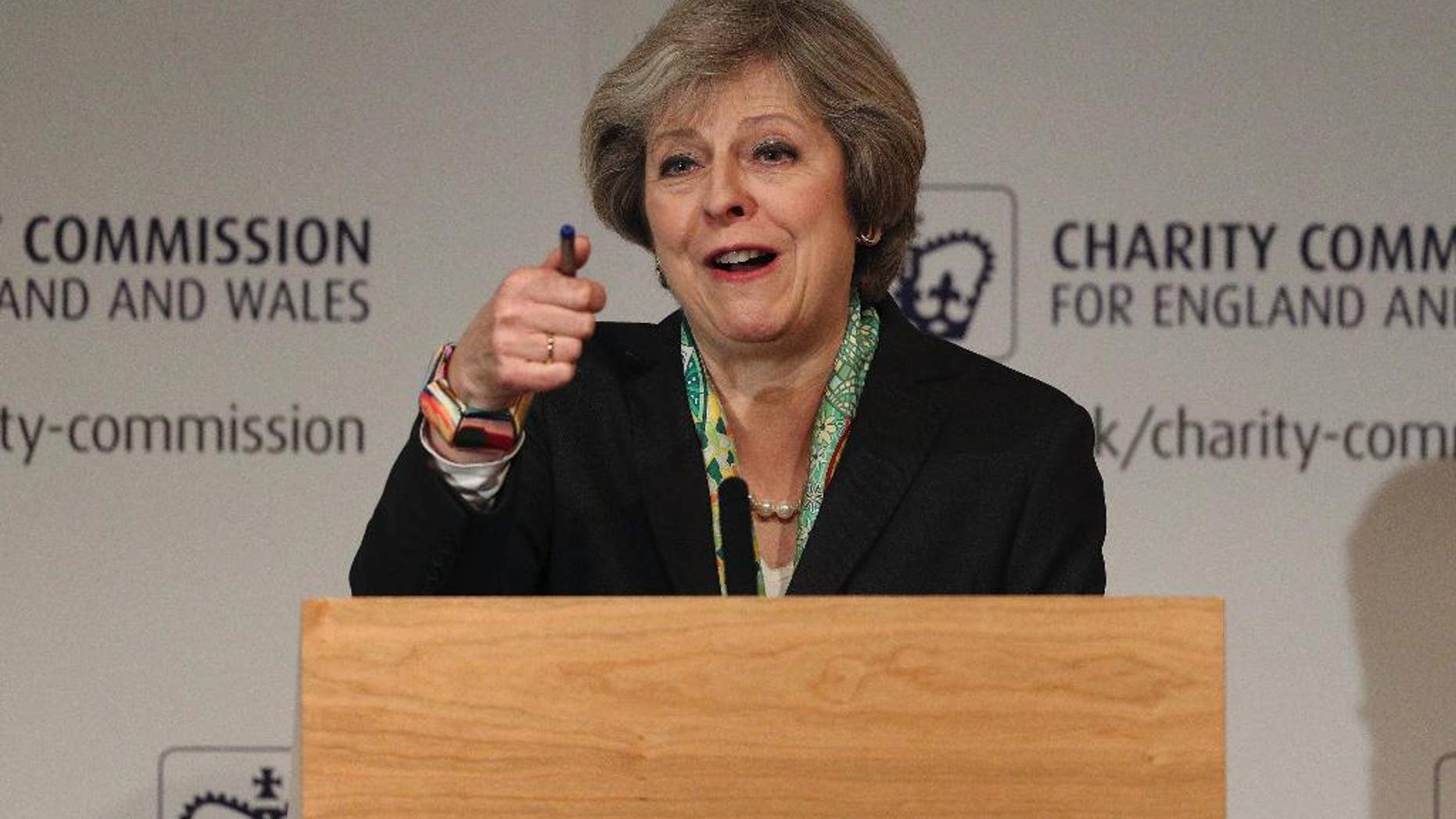 Britain's Prime Minister Theresa May speaks to members of the Charity Commission for England and Wales at The Royal Society in London, where she detailed plans to provide greater support for those suffering mental health problems, Monday Jan. 9, 2017. (Dan Kitwood/Pool via AP)