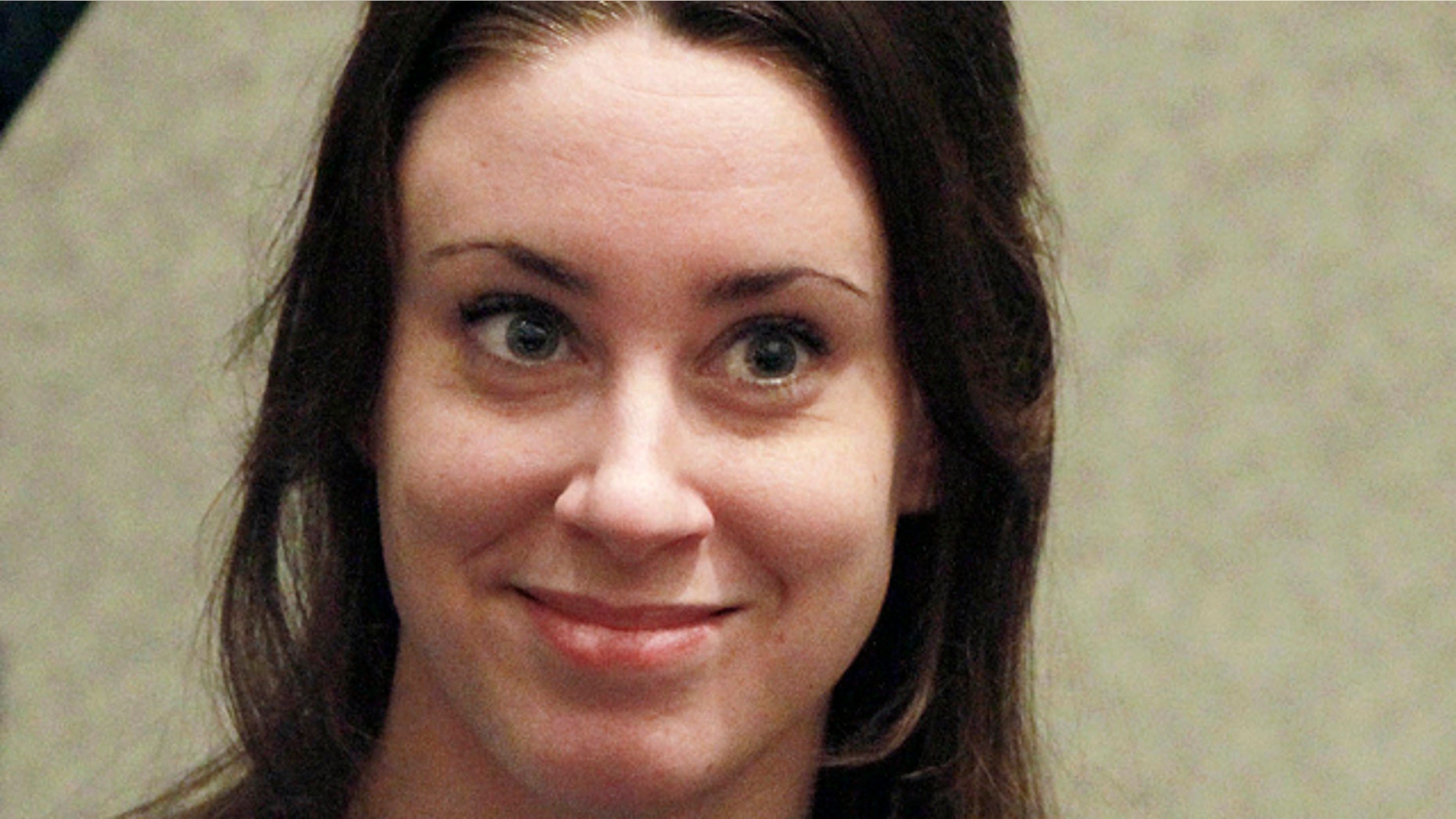 July 7, 2011: Casey Anthony smiles before the start of her sentencing hearing in Orlando, Fla.