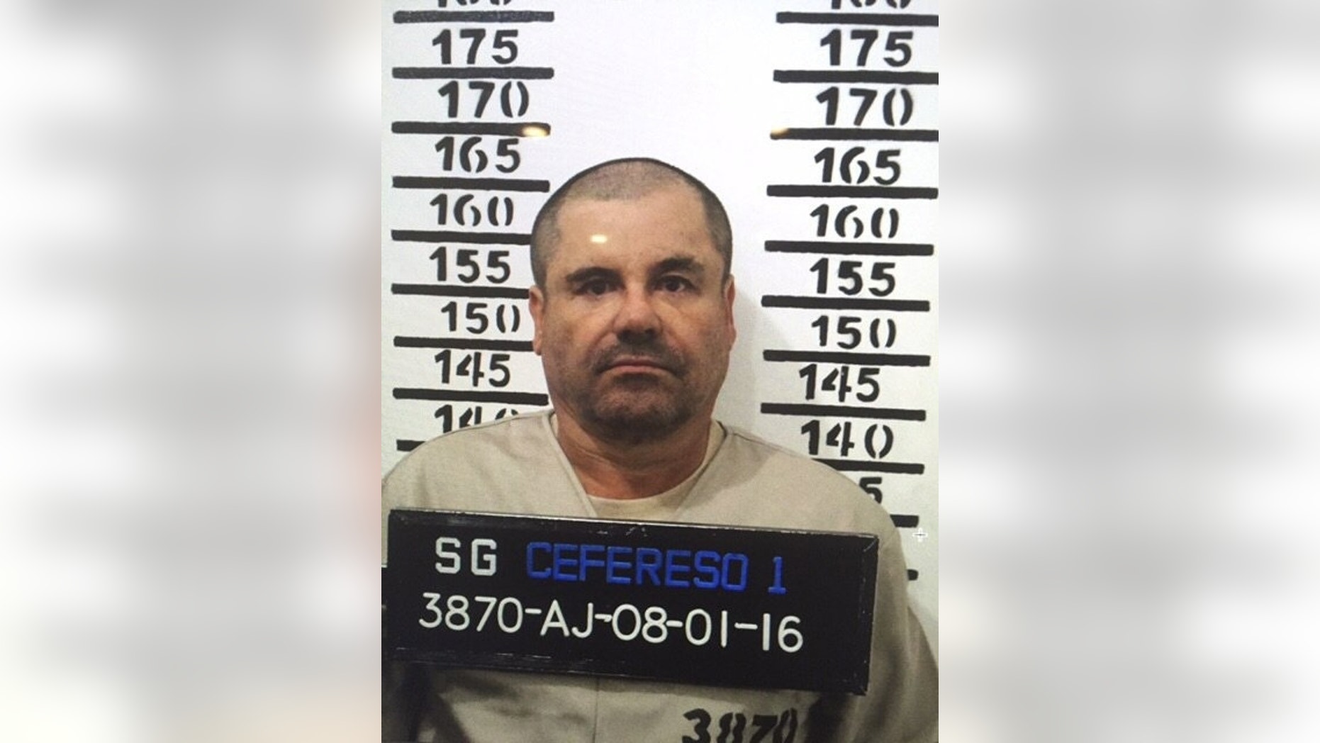 FILE - In this Jan. 8, 2016 file photo released by Mexico's federal government, Mexico's drug lord Joaquin "El Chapo" Guzman stands for his prison mug shot with the inmate number 3870 at the Altiplano maximum security federal prison in Almoloya, Mexico. According to Mexico's Foreign Ministry, Guzman was extradited to the United States on Thursday, Jan. 19 2017. (Mexico's federal government via AP, File)