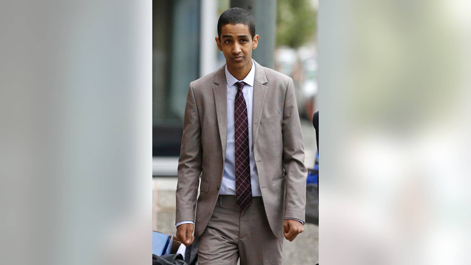 FILE - In this Oct. 16, 2014 file photo, Robel Phillipos, a college friend of Boston Marathon bombing suspect Dzhokhar Tsarnaev, arrives at federal court to attend his trial in Boston. Closing arguments are being held in the case Tuesday, Oct. 21, 2014. Phillipos is charged with lying to the FBI about being in Tsarnaev's dorm room while two other friends removed a backpack containing fireworks and other potential evidence several days after the April 15, 2013 attack. (AP Photo/Steven Senne, File)