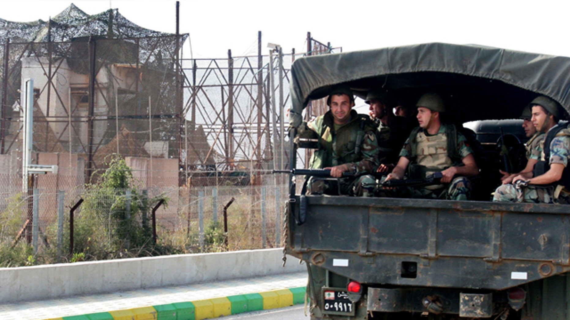 June 5: Lebanese army soldiers sit on their truck as they patrol the Lebanese-Israeli border near the village of Kfar Kila, south Lebanon.