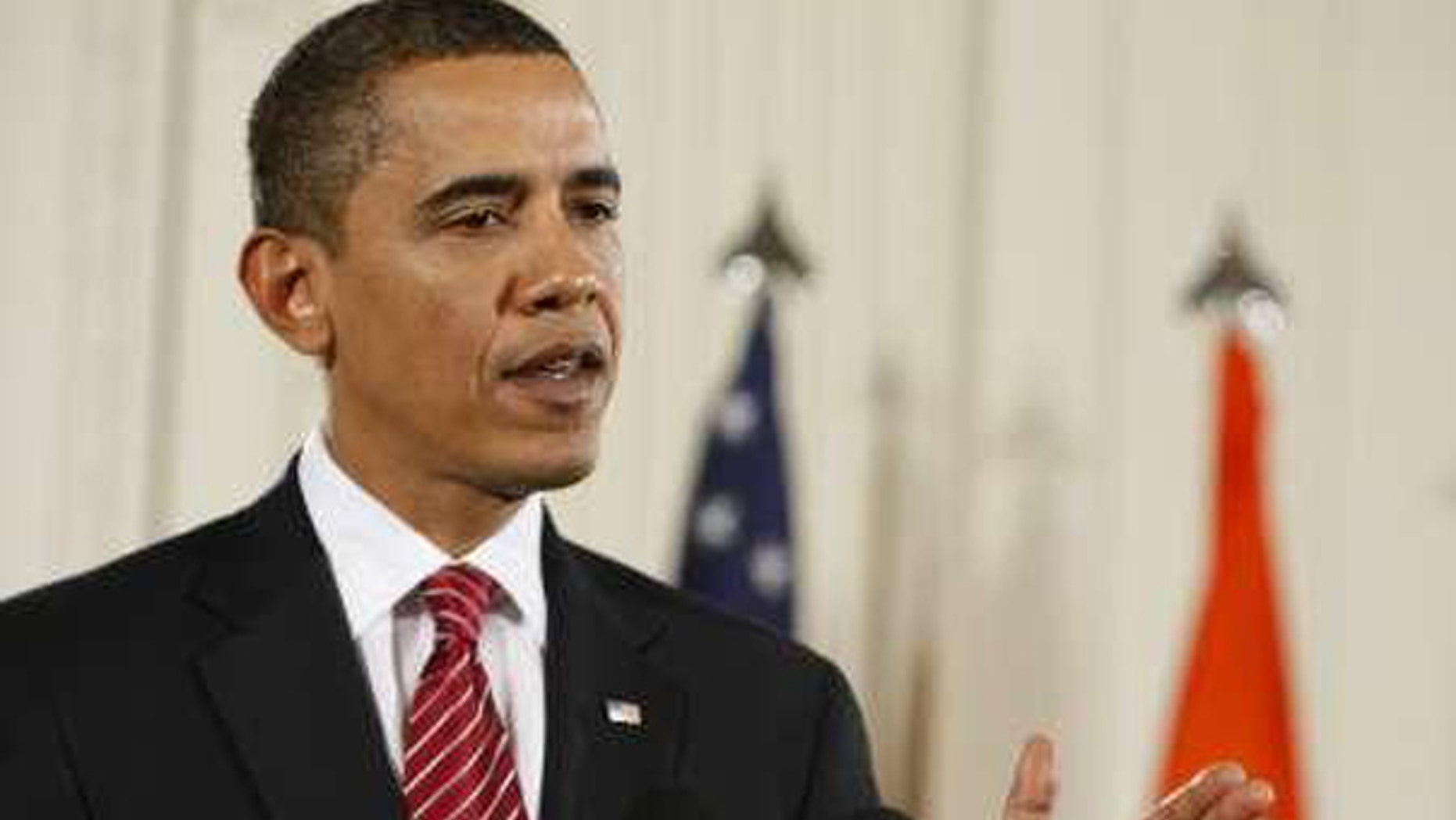 President Obama answers a question during a joint news conference with Prime Minister of India Manmohan Singh at the White House in Washington, November 24, 2009. (Reuters)