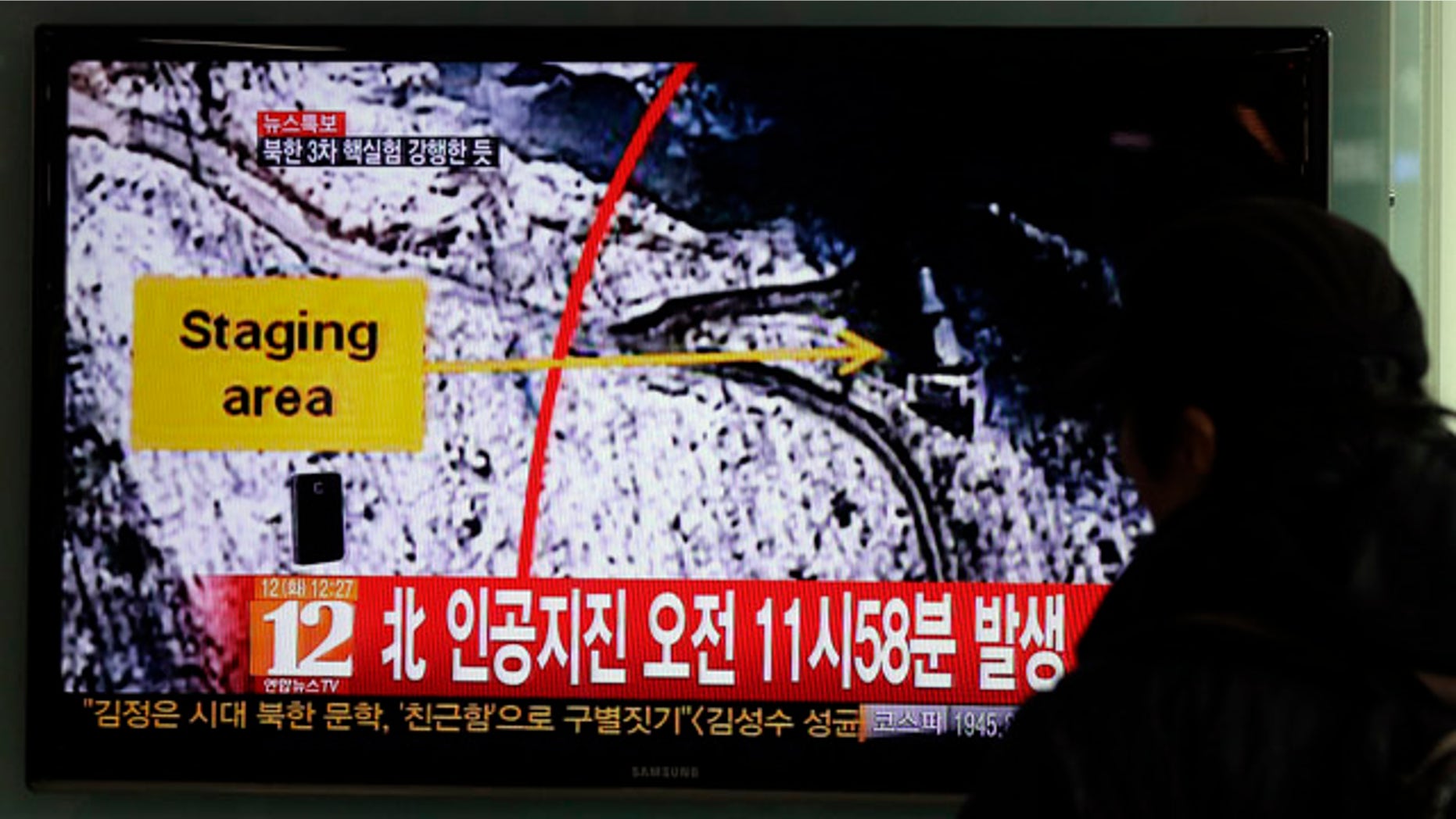 Feb. 12, 2013: South Korean passenger watches a news reporting about North Korea's nuclear test on a TV screen at the Seoul train station in Seoul, South Korea.