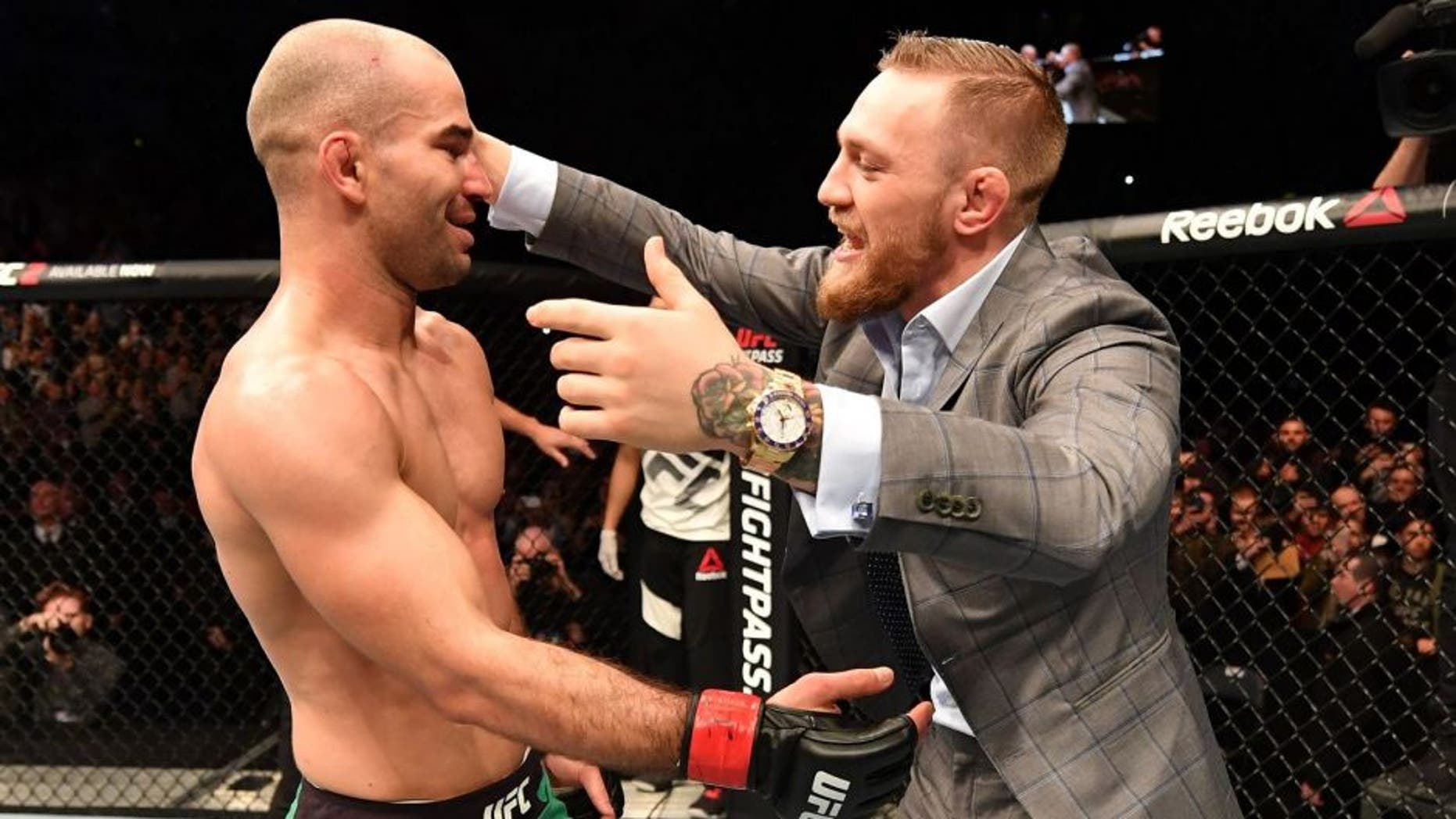 BELFAST, NORTHERN IRELAND - NOVEMBER 19: (L-R) Artem Lobov of Russia celebrates with teammate and UFC champion Conor McGregor after his featherweight bout against Teruto Ishihara during the UFC Fight Night at the SSE Arena on November 19, 2016 in Belfast, Northern Ireland. Lobov defeated Ishihara by unanimous-decision. (Photo by Brandon Magnus/Zuffa LLC/Zuffa LLC via Getty Images)