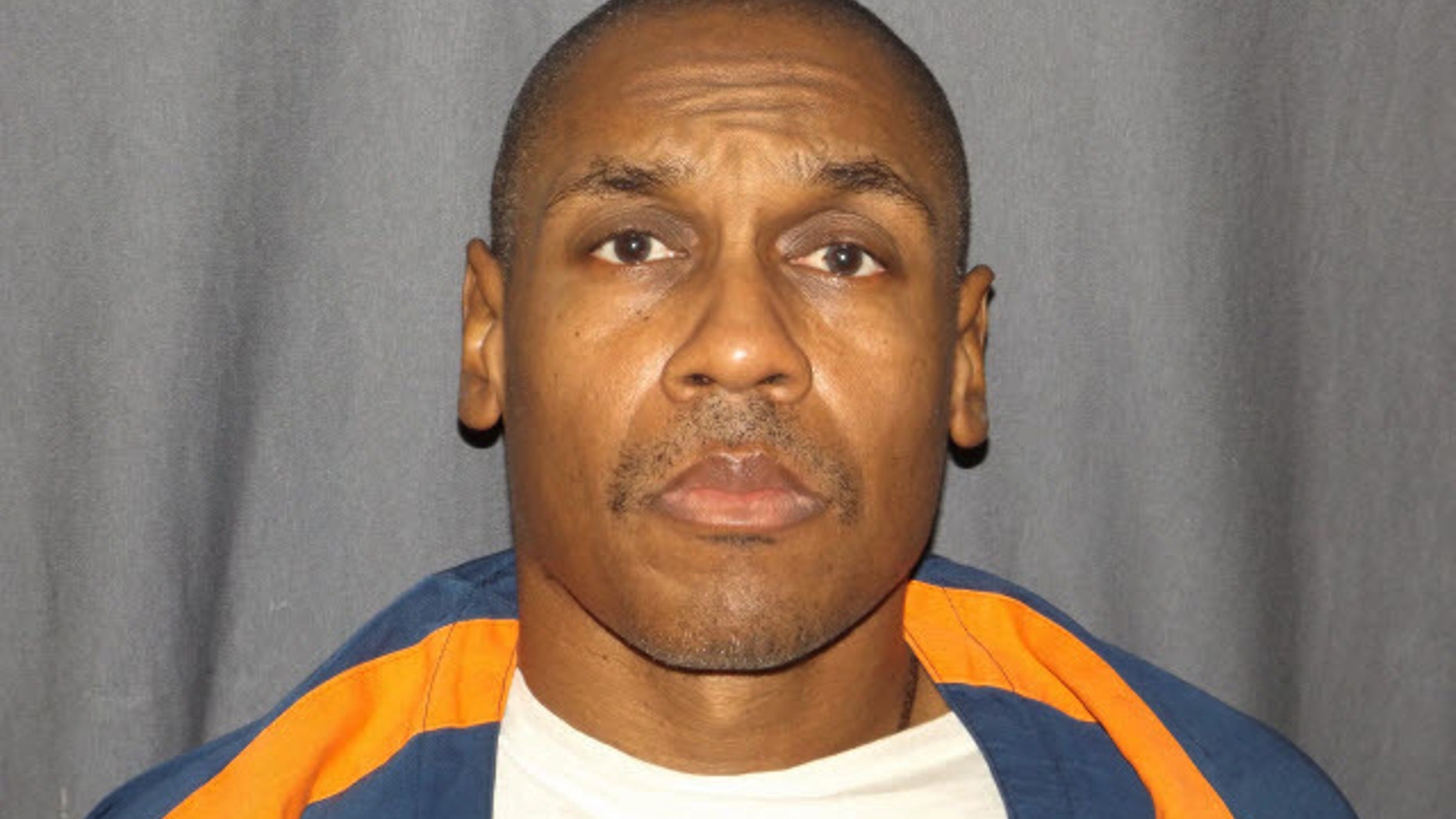 In this undated photo provided by the Michigan Department of Corrections shows Michael Darnell Harris. Ingham County Circuit Court set a Sept. 23, 2016, hearing to consider new evidence that could overturn the conviction of Harris in the slaying of Ula Curdy, the Detroit Free Press reported. Harris is serving life sentences for killing Curdy as well as multiple other women. (Michigan Department of Corrections via AP)