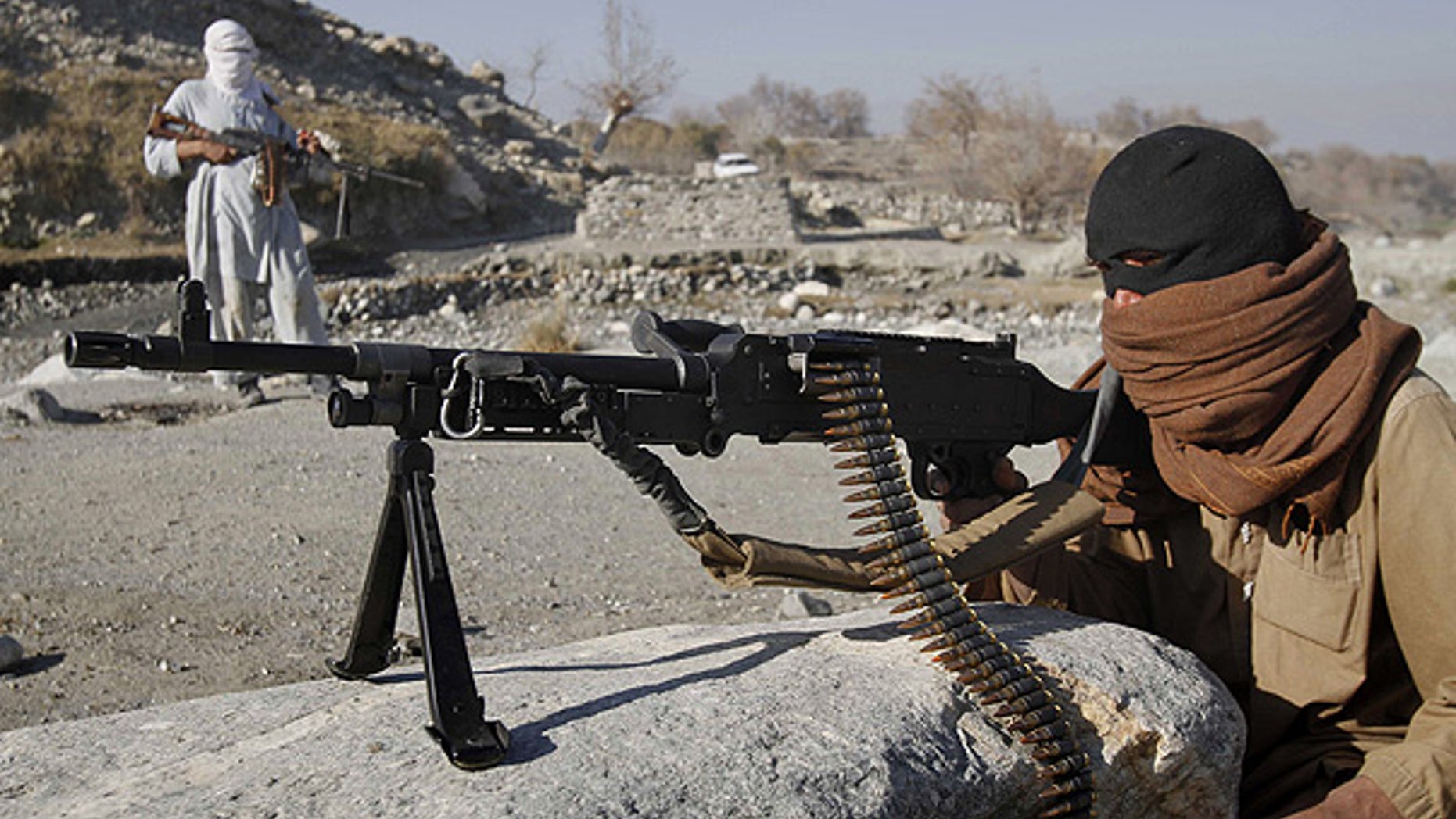 Dec. 13: Taliban fighters man a checkpoint in an undisclosed location east of Kabul, Afghanistan.