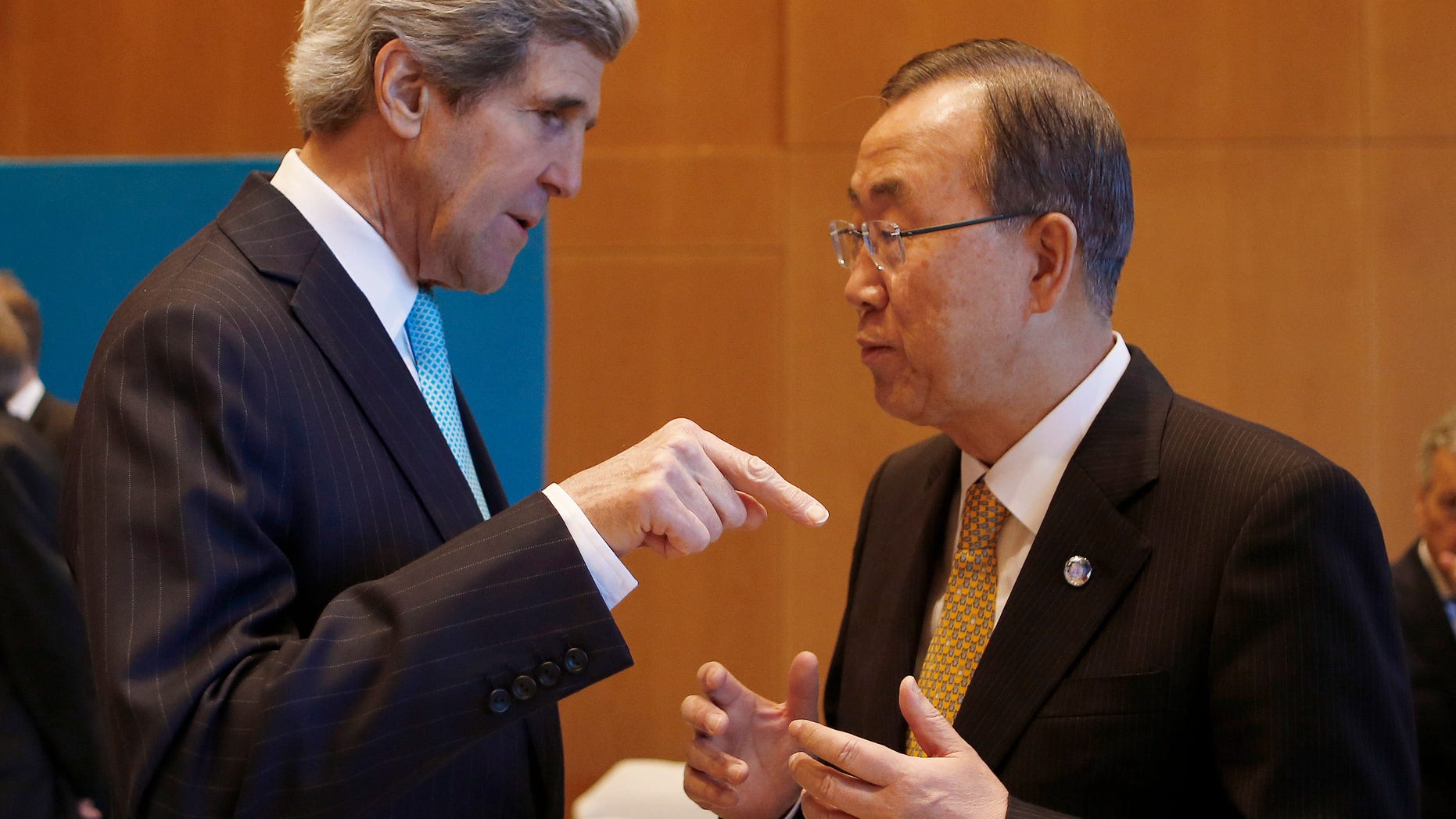 U.S. Secretary of State John Kerry, left, talks to U.N. Secretary-General Ban Ki-moon prior to the Syrian peace talks in Montreux, Switzerland, Wednesday, Jan. 22, 2014. Ban made a rare effort at solo diplomacy this week when he invited Iran to join this week’s Syria peace talks, but it backfired, raising questions about the effectiveness of a U.N. secretary-general better known _ and often criticized _ for his reserved and scripted style. (AP Photo/Arnd Wiegmann, Pool)