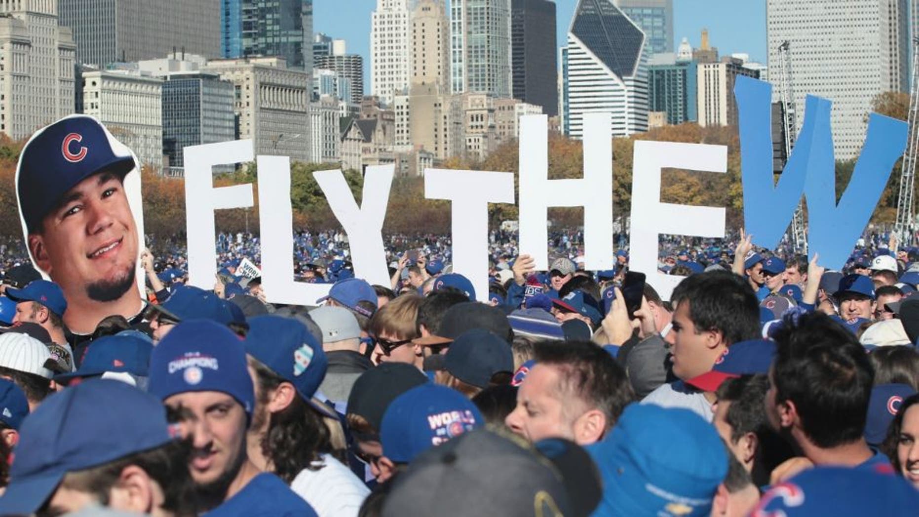 CHICAGO, IL - NOVEMBER 04: Chicago Cubs fans attend a rally in Grant Park to celebrate the team's World Series victory on November 4, 2016 in Chicago, Illinois. Hundreds of thousand of people lined the streets in downtown Chicago as the team paraded by in double deck buses on the way to the rally. (Photo by Scott Olson/Getty Images)