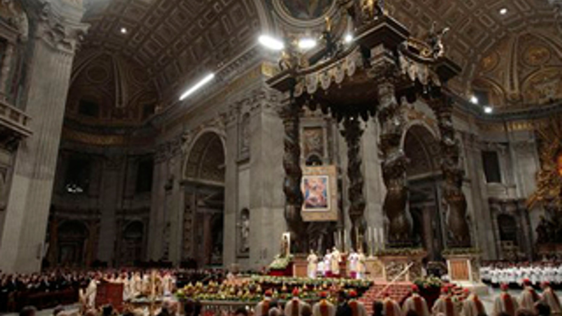 A general view of St. Peter's Basilica as Pope Benedict XVI celebrates Christmas Mass, at the Vatican, Thursday, Dec. 24, 2009. A woman jumped the barriers in St. Peter's Basilica and knocked down the pontiff as he walked down the main aisle to begin Christmas Eve Mass on Thursday, a Vatican spokesman said. The Rev. Ciro Benedettini said the 82-year-old pope quickly got up and was unhurt. (AP Photo/Gregorio Borgia)