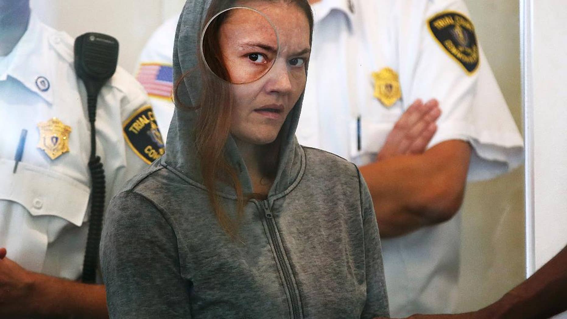FILE - In this Sept. 21, 2015 file photo, Rachelle Bond is arraigned on charges of acting after the fact in helping to dispose of the body of her daughter, dubbed Baby Doe, after her boyfriend allegedly killed the girl, in Dorchester District Court, in Boston. A Suffolk Superior Court judge on Thursday, Dec. 1, 2016, scheduled Bond’s trial for Feb. 22 in Boston. (Pat Greenhouse/The Boston Globe via AP, Pool)
