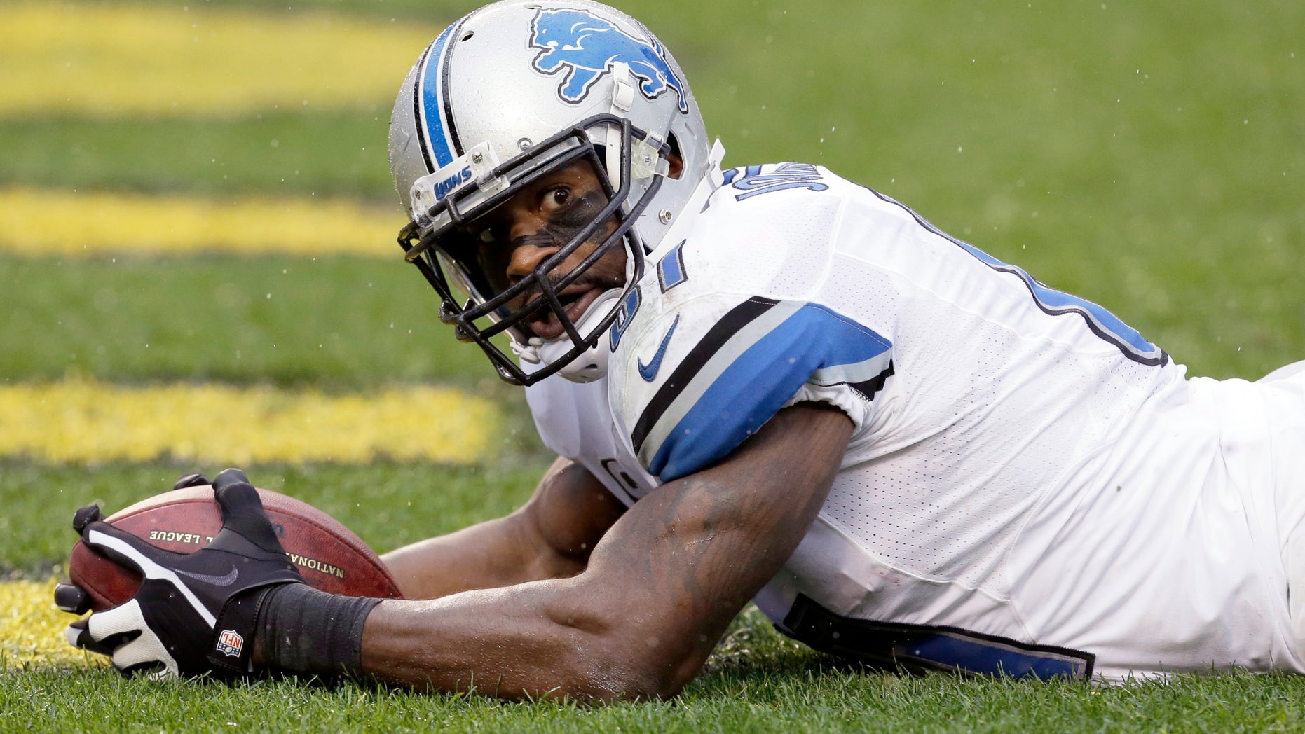 Detroit Lions wide receiver Calvin Johnson (81) lays in the end zone after making a touchdown catch in the first half of an NFL football game against the Pittsburgh Steelers in Pittsburgh, Sunday, Nov. 17, 2013. (AP Photo/Gene J. Puskar)