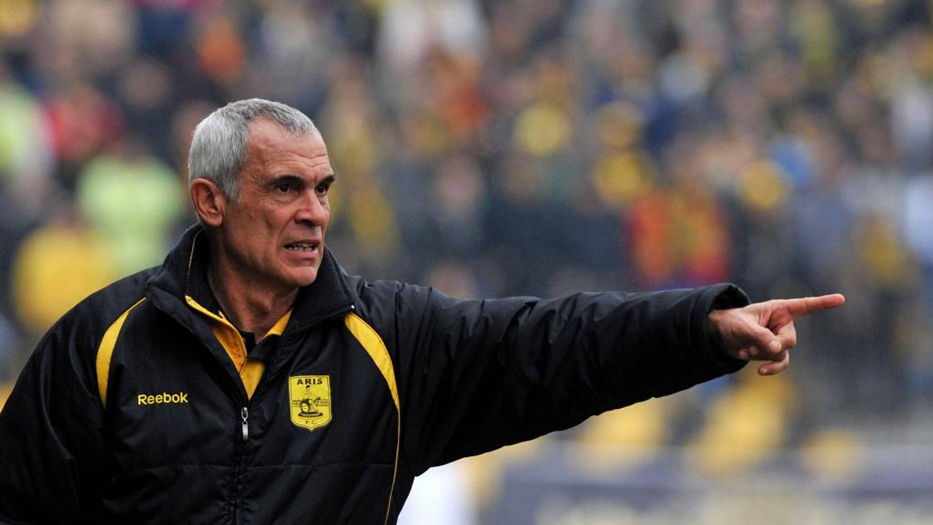 FILE - In this Feb. 17, 2010 file photo, former Aris' head coach Hector Cuper of Argentina, gives instructions to his players during a Greek League soccer match in Thessaloniki, Greece. The Egyptian Football Association announced on Monday, March 2, 2015 that they have appointed Cuper as the new manager of its national team. The 59-year old previously led the Emirati al-Wasl club, and the Spanish Racing de Santander. Egypt's team has been without a fulltime manager since American Bob Bradley quit in late 2013 after he failed to take the Pharaohs to the World Cup in Brazil. Egyptian soccer suffered a massive setback when more than 70 soccer fans were killed in post-match violence in 2012. Last month, 20 fans died in a stampede outside a stadium as police fired tear gas. (AP Photo/Nikolas Giakoumidis, File)