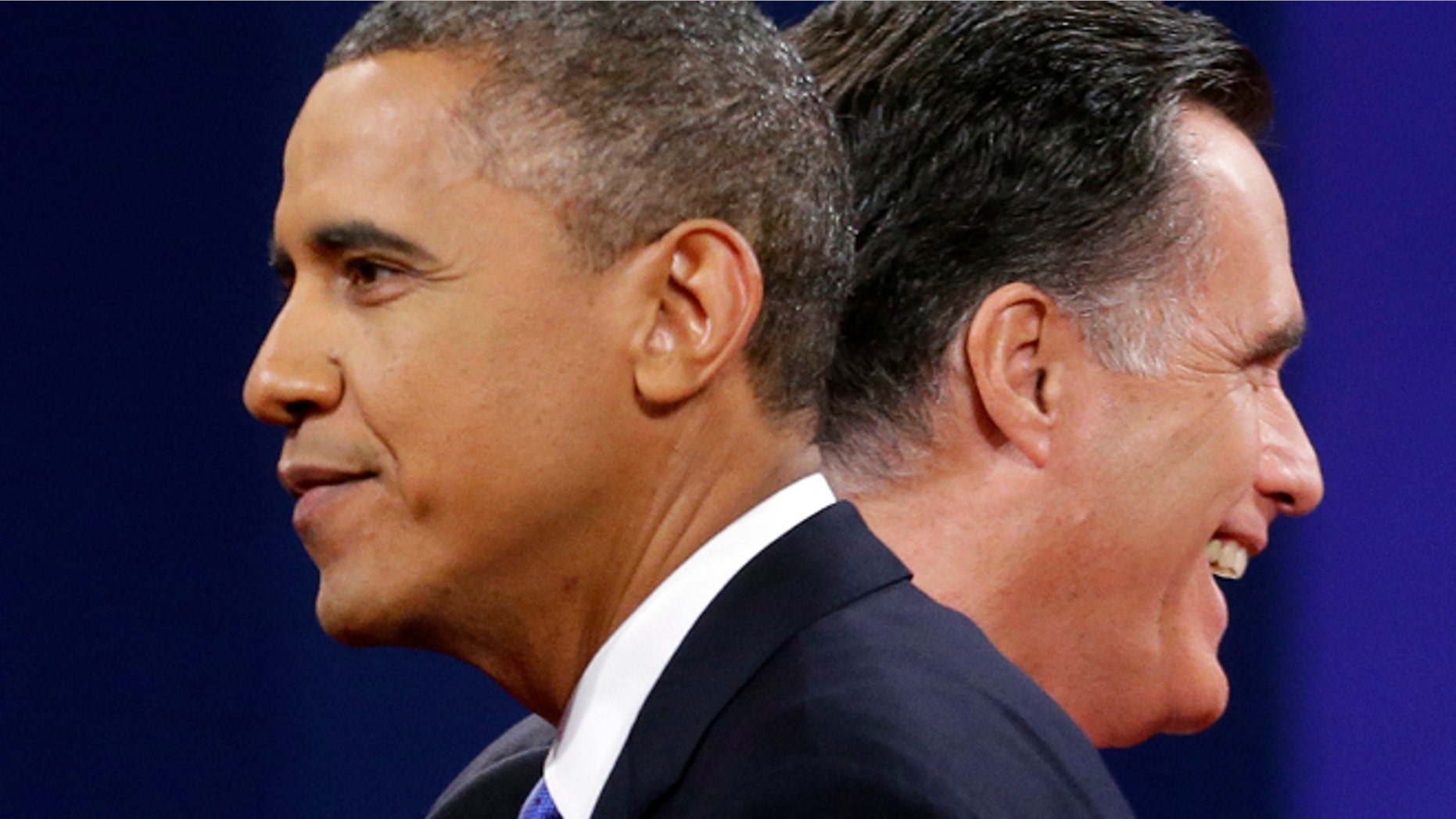 FILE: Oct 16, 2012: Mitt Romney and President Obama walks past each other at the end of their last debate at Lynn University, in Boca Raton, Fla.