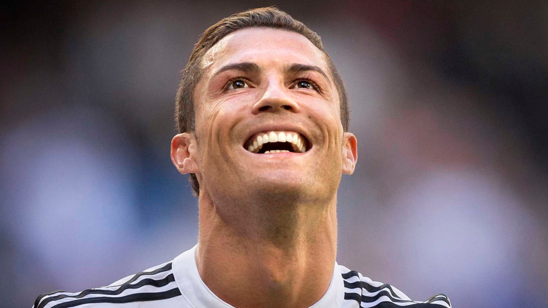 Real Madrid's Cristiano Ronaldo celebrates after scoring a goal during a La Liga soccer match between Real Madrid and Granada at the Santiago Bernabeu stadium in Madrid, Spain, Sunday, April 5, 2015. (AP Photo/Daniel Ochoa de Olza)
