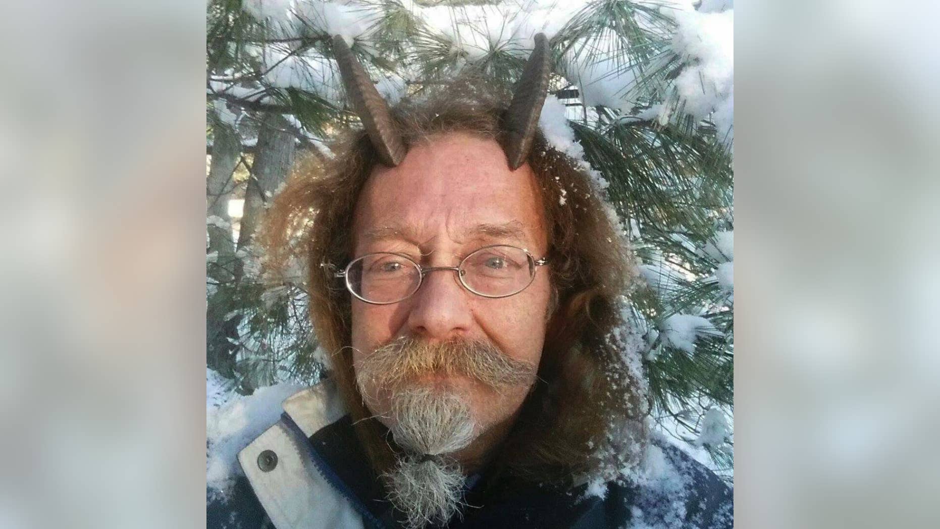 This Dec. 7, 2016, photo provided by Phelan Moonsong shows a portrait of himself in Portland, Maine. Moonsong, an ordained Pagan priest, finally has gotten the OK to sport goat horns in his Maine driver's license photo. Maine resident Moonsong said that unless he's sleeping or bathing, he always wears his goat horns, which serve as his spiritual antennae and help him educate others about Paganism. (Phelan Moonsong via AP)