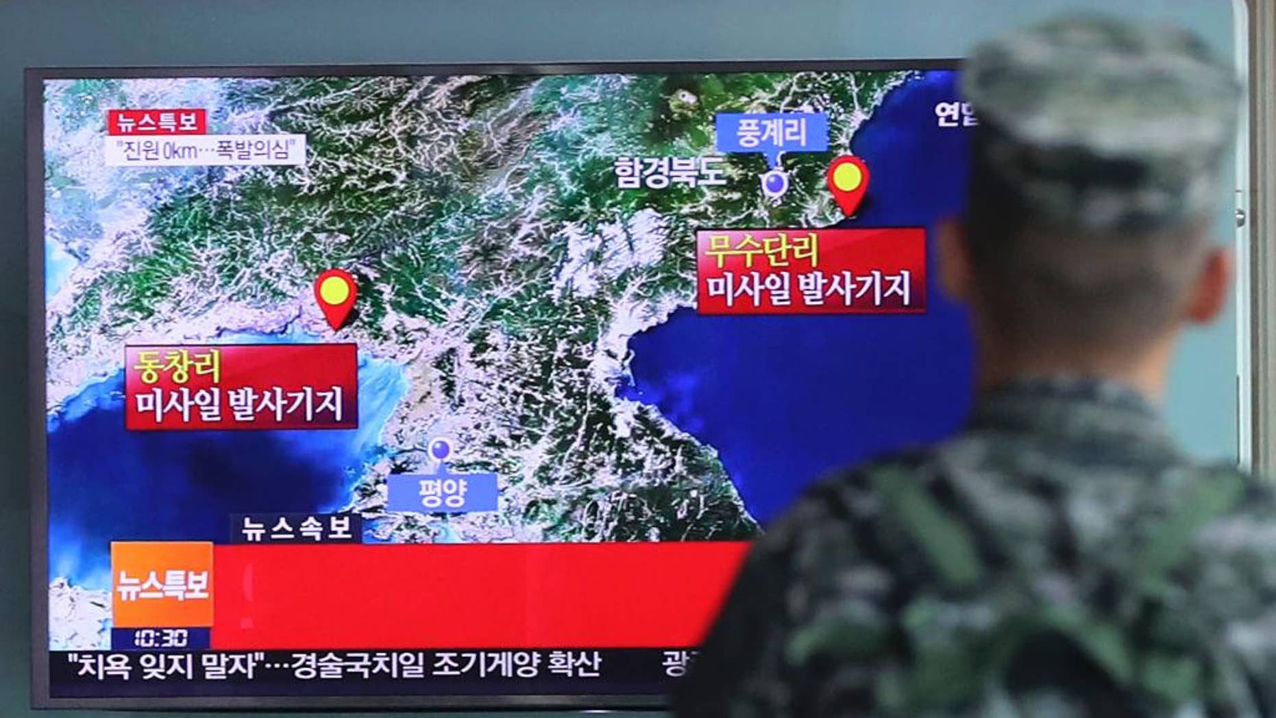 A South Korean marine watches a TV screen reporting about North Korea's possible nuclear test at the Seoul Railway Station in Seoul, South Korea, Friday, Sep. 9, 2016. South Korea's Yonhap news agency said Seoul believes North Korea conducted its fifth nuclear test explosion on Friday. The letters on the screen read: "Explosion suspect." (Kim Ju-sung/Yonhap via AP)