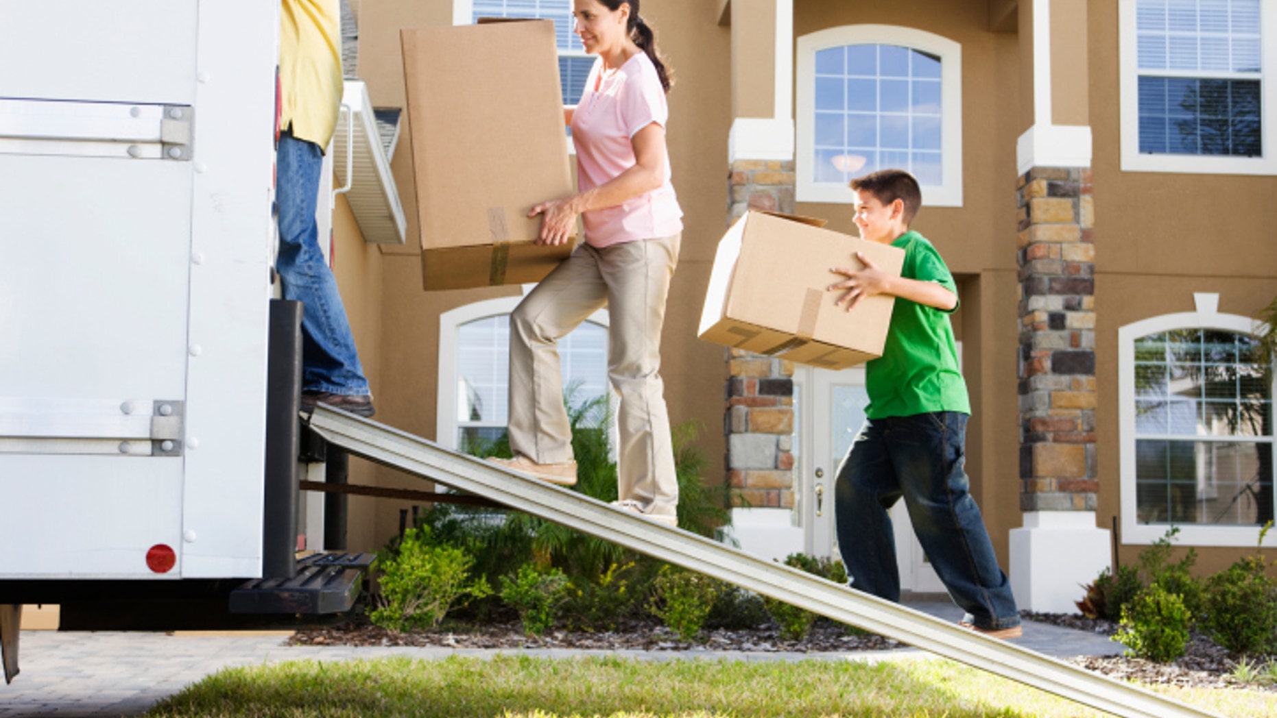 Family Loading Moving Truck