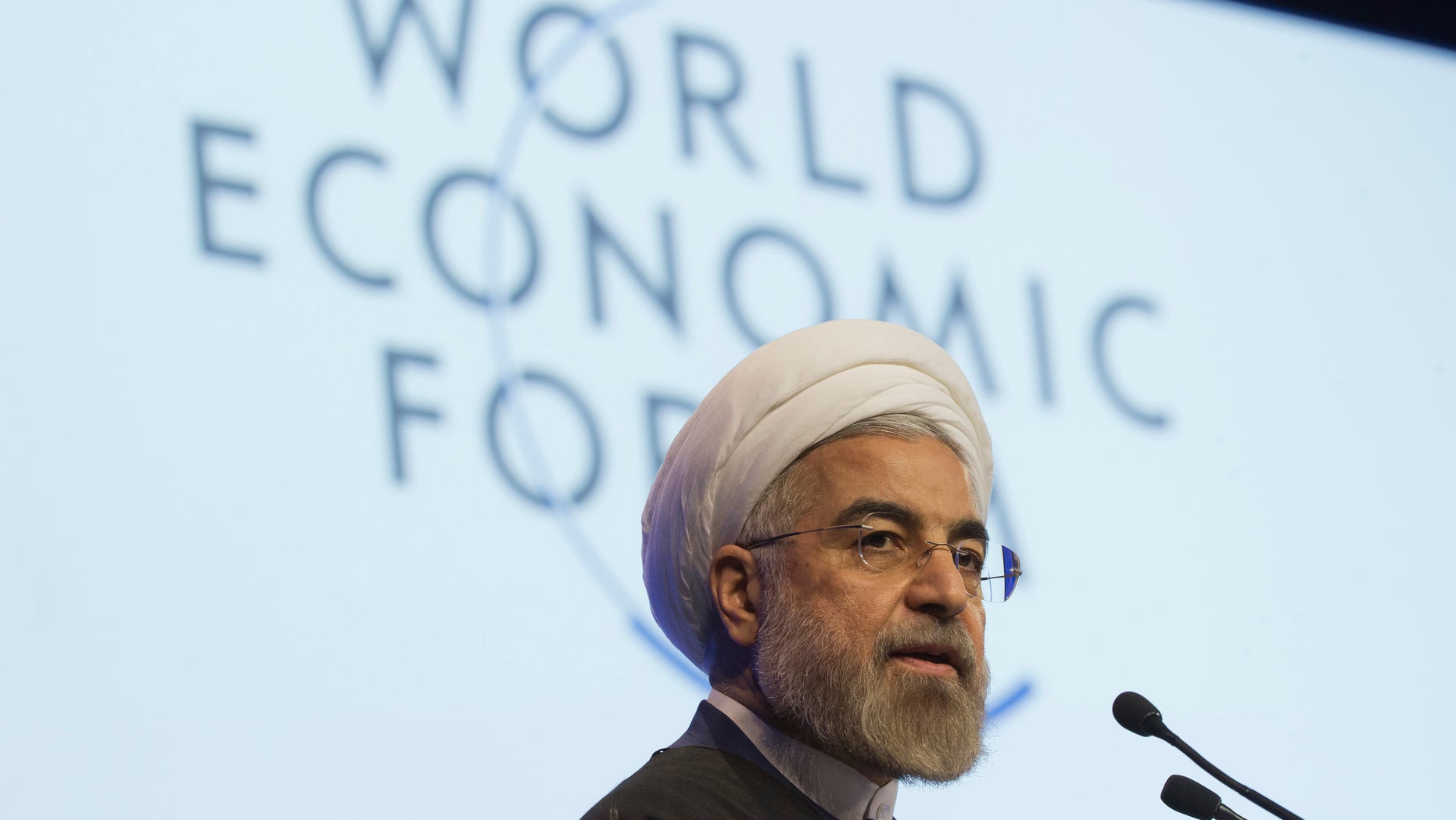 Iranian President Hassan Rouhani, speaks during a session of the World Economic Forum in Davos, Switzerland, Thursday, Jan. 23, 2014. Leaders gathered in the Swiss ski resort of Davos have made it a top priority to push to reshape the global economy and cut global warming by shifting to cleaner energy sources. (AP Photo/Michel Euler)