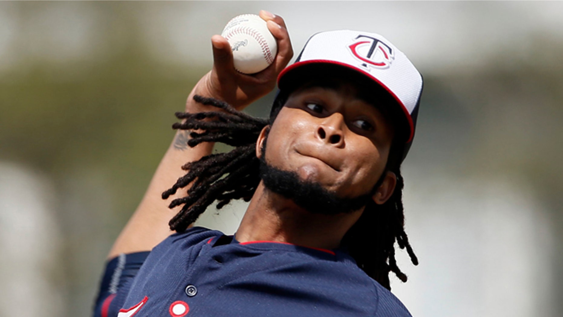 FILE - In this Tuesday March 3, 2015 file photo, Minnesota Twins starting pitcher Ervin Santana (54) throws batting practice at baseball spring training in Fort Myers, Fla. Minnesota Twins pitcher Ervin Santana has been suspended for 80 games by Major League Baseball after testing positive for the performance-enhancing substance Stanozolol. MLB announced the punishment Friday, April 3, 2015. (AP Photo/Tony Gutierrez, File)