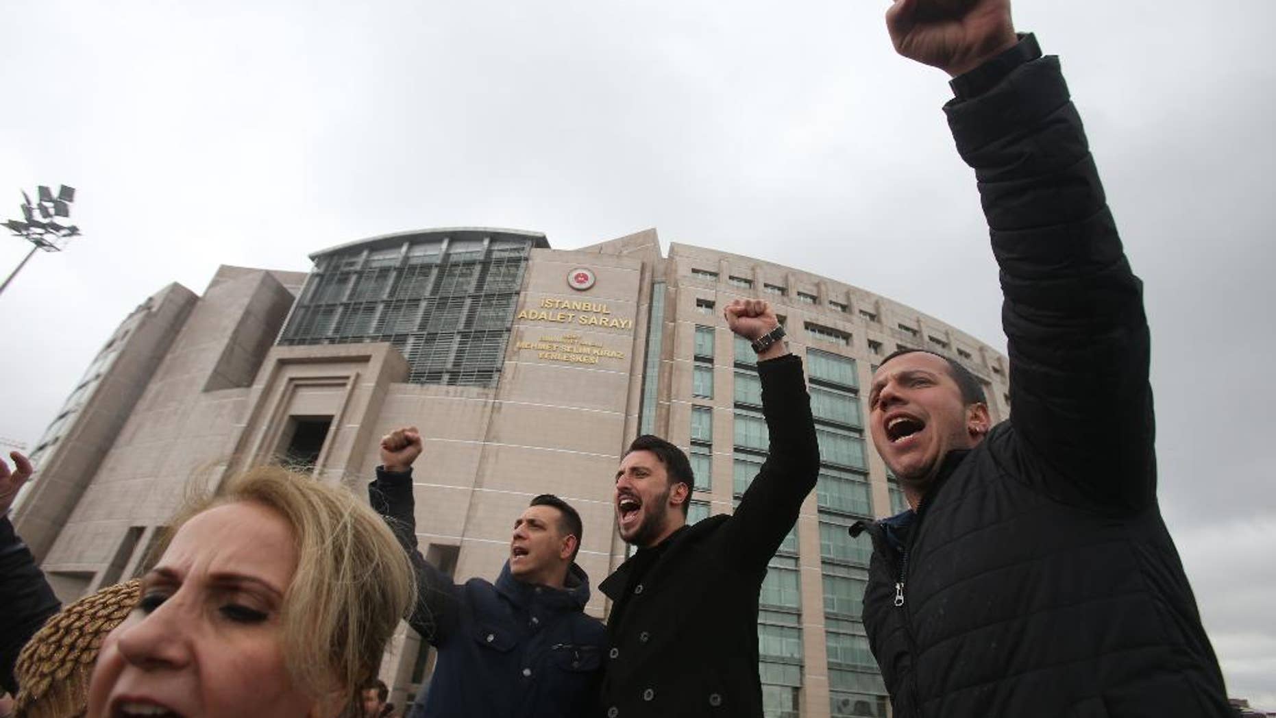 Supporters of the main opposition Republican People's Party, or CHP, chant slogans during a protest outside Istanbul's Court House, Tuesday, April 18, 2017. Hundreds of people are queuing in front of Turkey's election board to submit petitions requesting that the electoral authority reverse a controversial decision during Sunday's referendum to accept ballots without official stamps. (AP Photo/Petros Karadjias)
