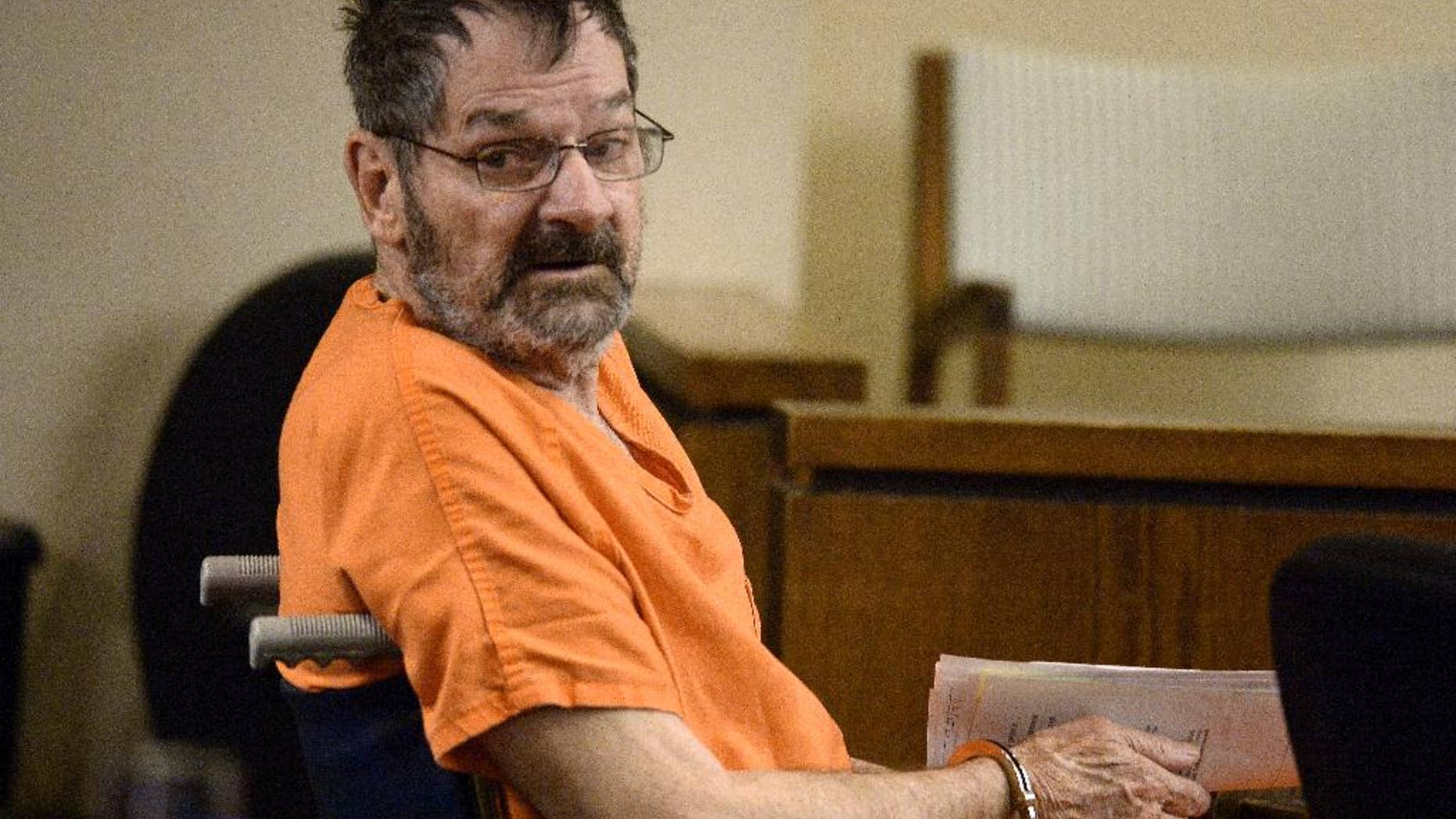 FILE - In this April 24, 2014 file photo, Frazier Glenn Cross, who is also known as Frazier Glenn Miller, looks around after being wheeled into court in Olathe, Kan. THE avowed white supremacist accused of killing three people outside two suburban Kansas City Jewish facilities on the eve of Passover this year says a mental evaluation has determined that he is mentally fit to stand trial. (AP Photo/The Kansas City Star, John Sleezer, Pool, File)