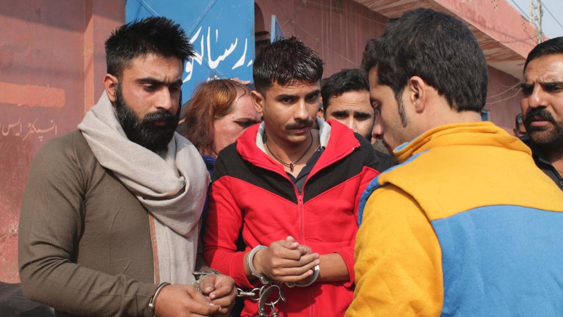 People allegedly involved in the flogging of a transgender person arrive at a court in Sialkot, Pakistan, Monday, Nov. 14, 2016. A Pakistani officer said police have arrested 10 members of a criminal gang who flogged a transgender person and posted the incident on social media. The officer said Monday's arrests were made in the eastern Pakistani city of Sialkot after a video of the flogging was shared thousands of times on social media. (AP Photo/Shahid Ikram)