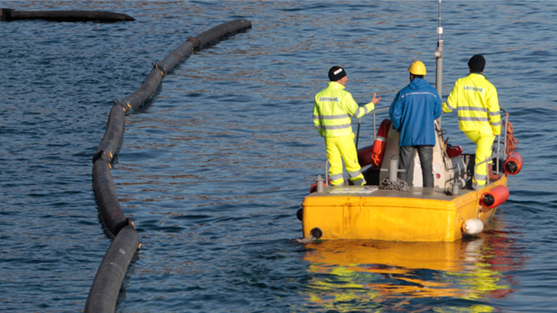 Jan. 21: Workers prepare their work of oil recovery from the cruise ship Costa Concordia off the Tuscan island off Giglio, Italy.