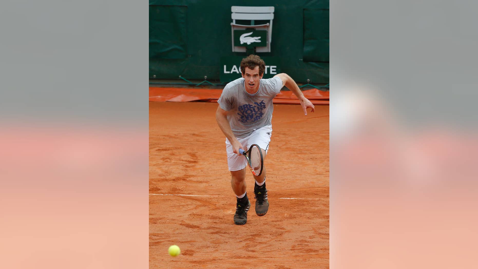 Britain's Andy Murray runs for the ball during a training session for the French Open tennis tournament, at the Roland Garros stadium in Paris, Friday, May 23, 2014. The French Open tennis tournament starts Sunday. (AP Photo/Michel Euler)