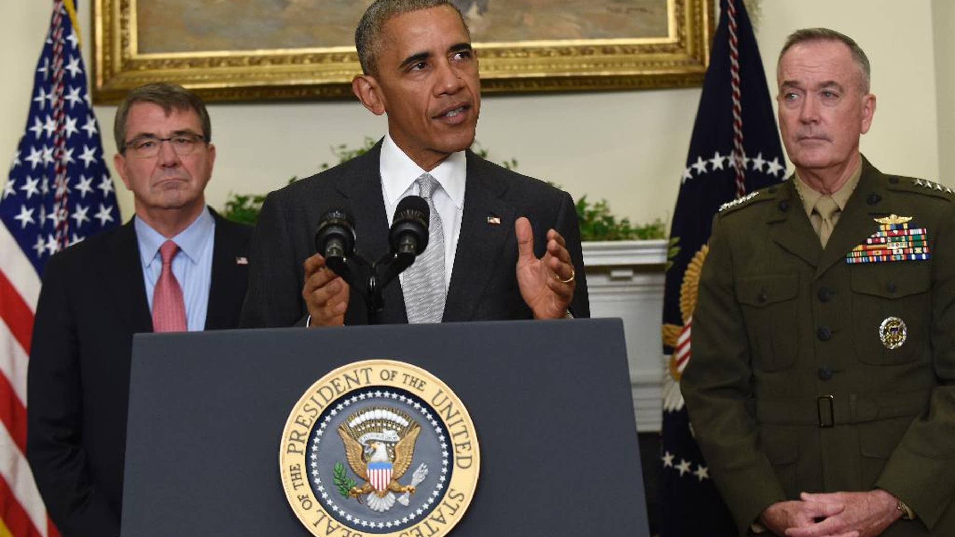 President Barack Obama, flanked by Defense Secretary Ash Carter, left, and Joint Chiefs Chairman Gen. Joseph Dunford, makes a statement on Afghanistan from the Roosevelt Room of the White House in Washington, Wednesday, July 6, 2016. The president said the U.S. will leave 8,400 troops in Afghanistan when he completes his term, down slightly from the current number but well up from the 5,500 he announced previously, arguing America's interests depend on helping Afghanistan's struggling government fight continuing threats from the Taliban and others. (AP Photo/Susan Walsh)