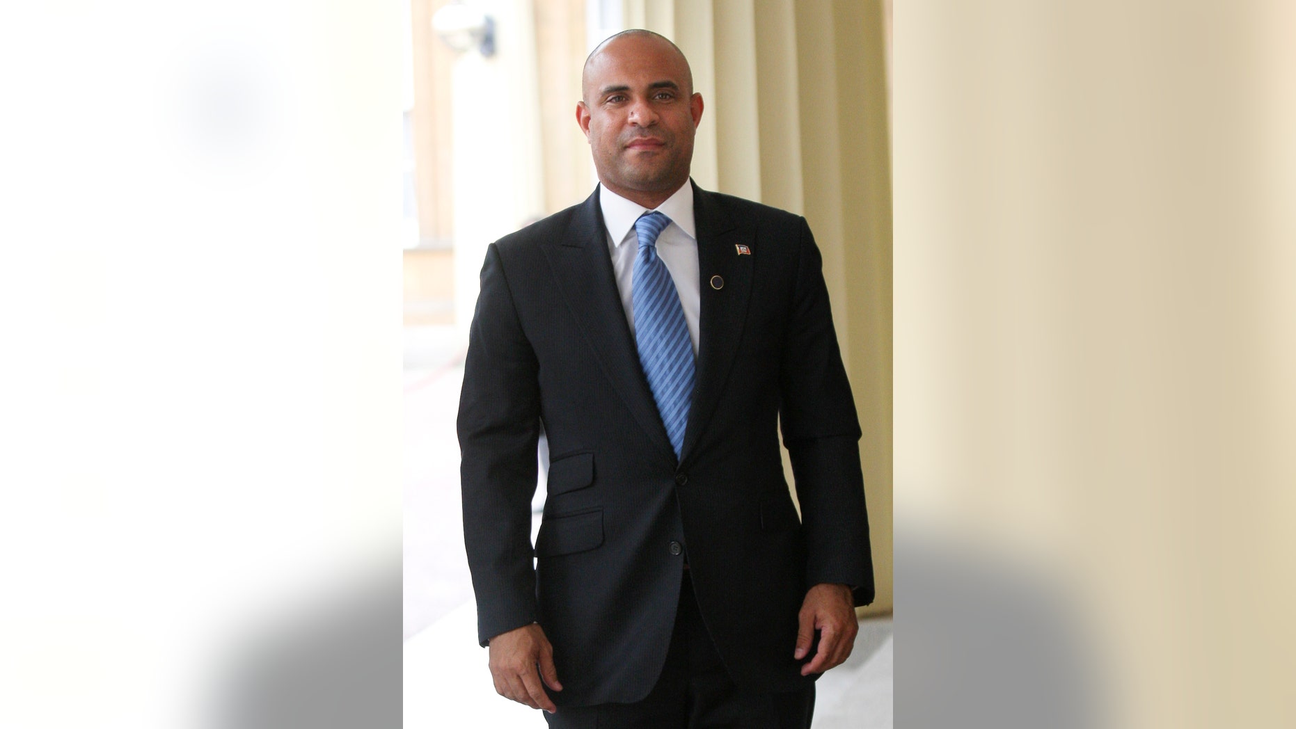 FILE - Laurent Lamothe, Haitian Prime Minister and Minister of Foreign Affairs, arrives at Buckingham Palace in London in this July 27, 2012 file photo. Lamothe plans to spend Wednesday Nov. 20, 2013 on a whirlwind tour through Silicon Valley's most elite tech campuses, hoping to convince some of the world's wealthiest and most successful corporate executives to share support and innovation with the poorest country in the Americas. (AP Photo/CARL COURT, File)